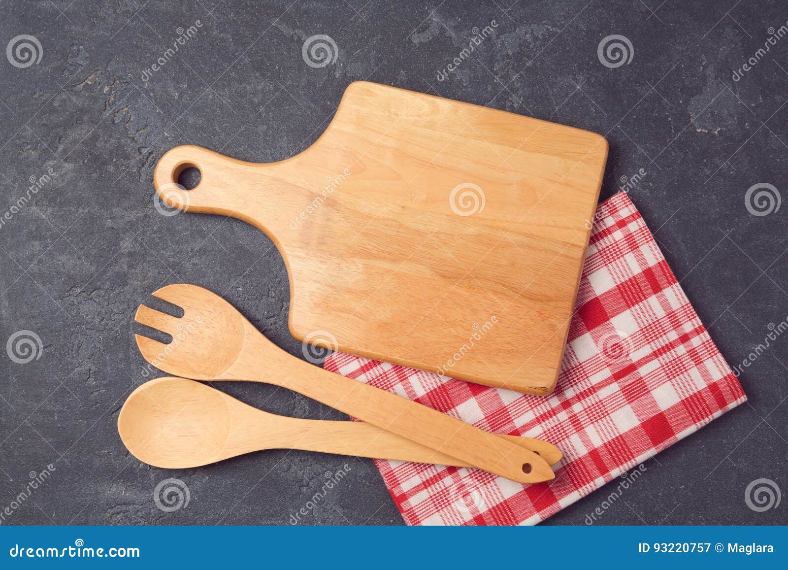 Kitchen Background with Cutting Board, Tablecloth and Utensils Over