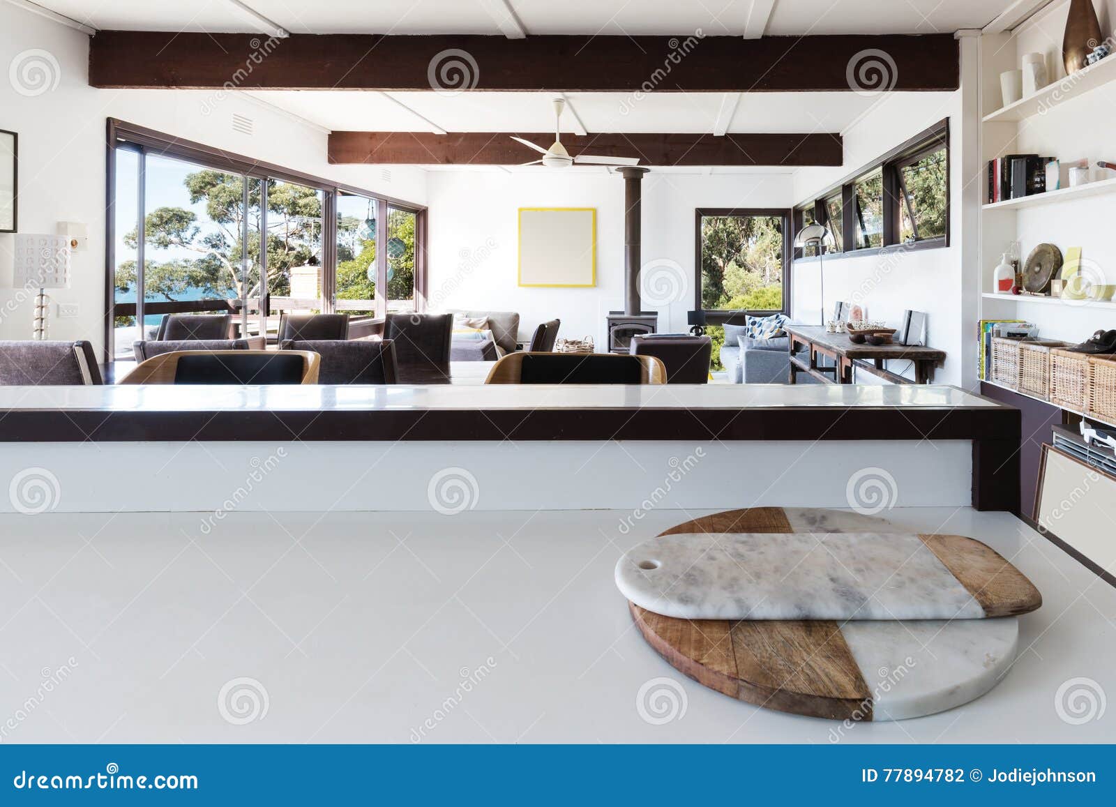 kitchen bench looking to open plan living room in retro beach ho