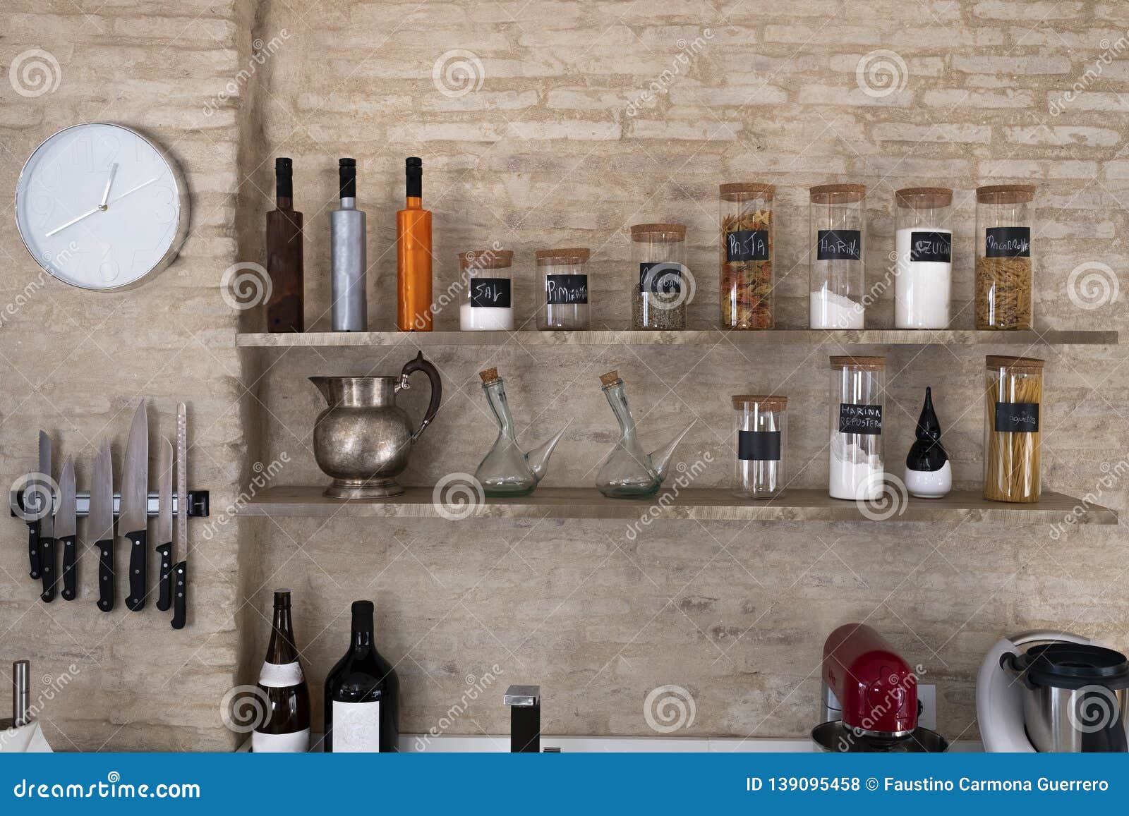 Kitchen Bench Shelves with Various Food Ingredients on Brick Background