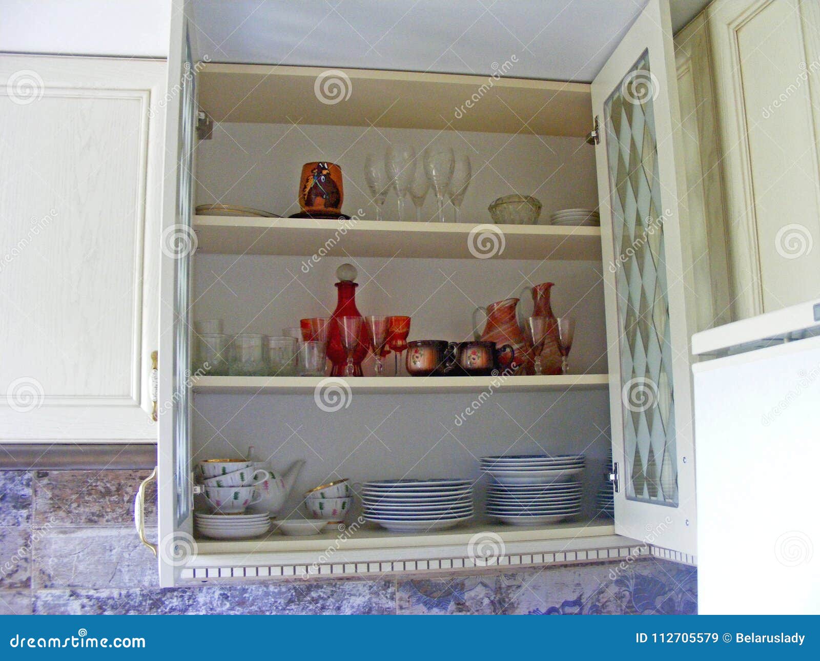 Kitchen Cabinet Close Up With Glass Shelves And Glasses Stock Image Image Of Design