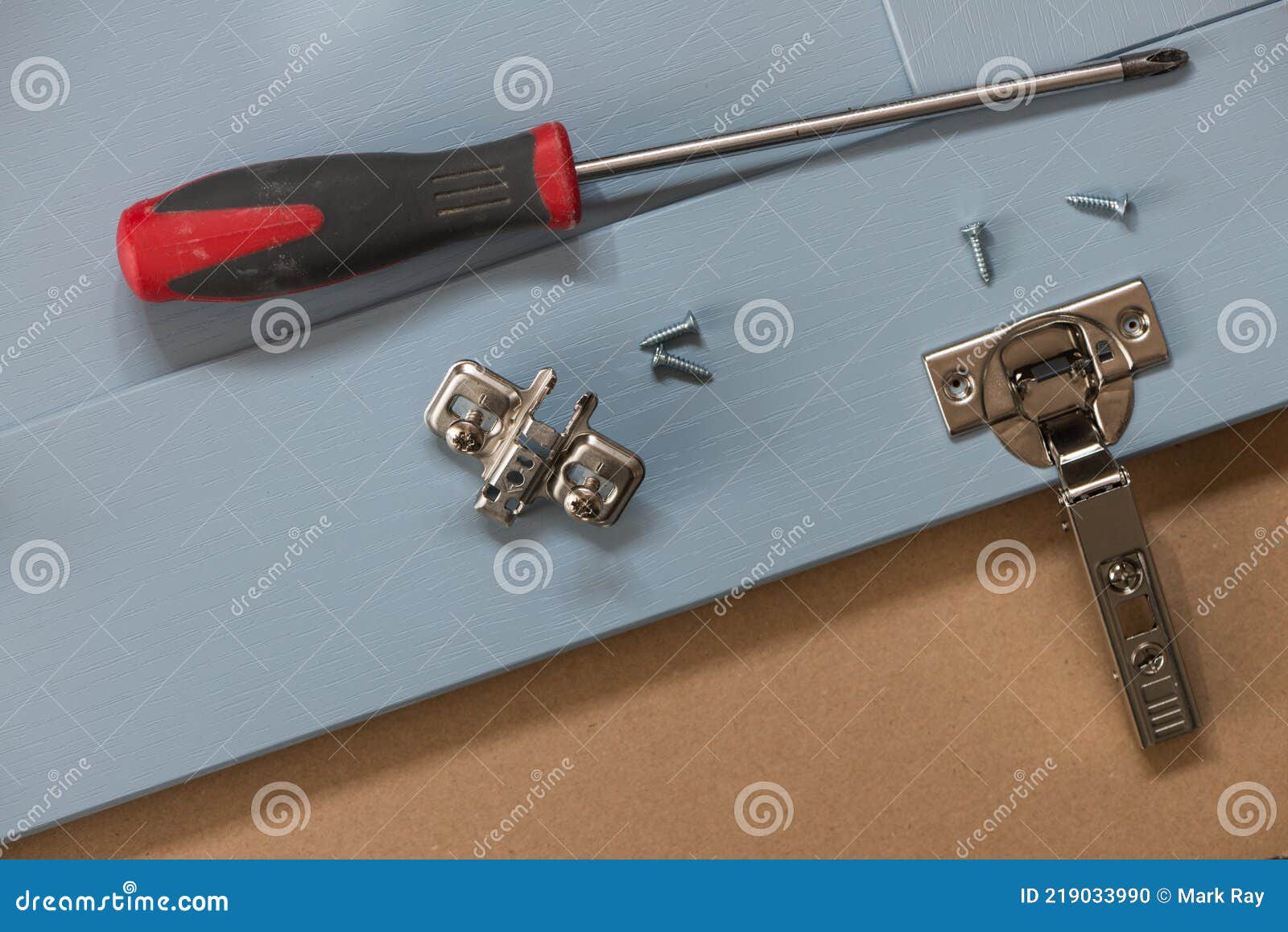 Kitchen Door with Hinge and Hand Screwdriver. Stock Photo Image of manufacturing