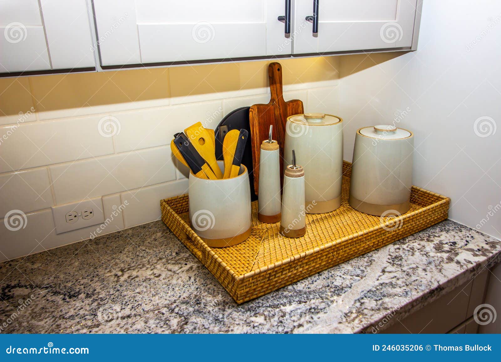 Kitchen Counter with Basket of Containers and Utensils Stock Photo