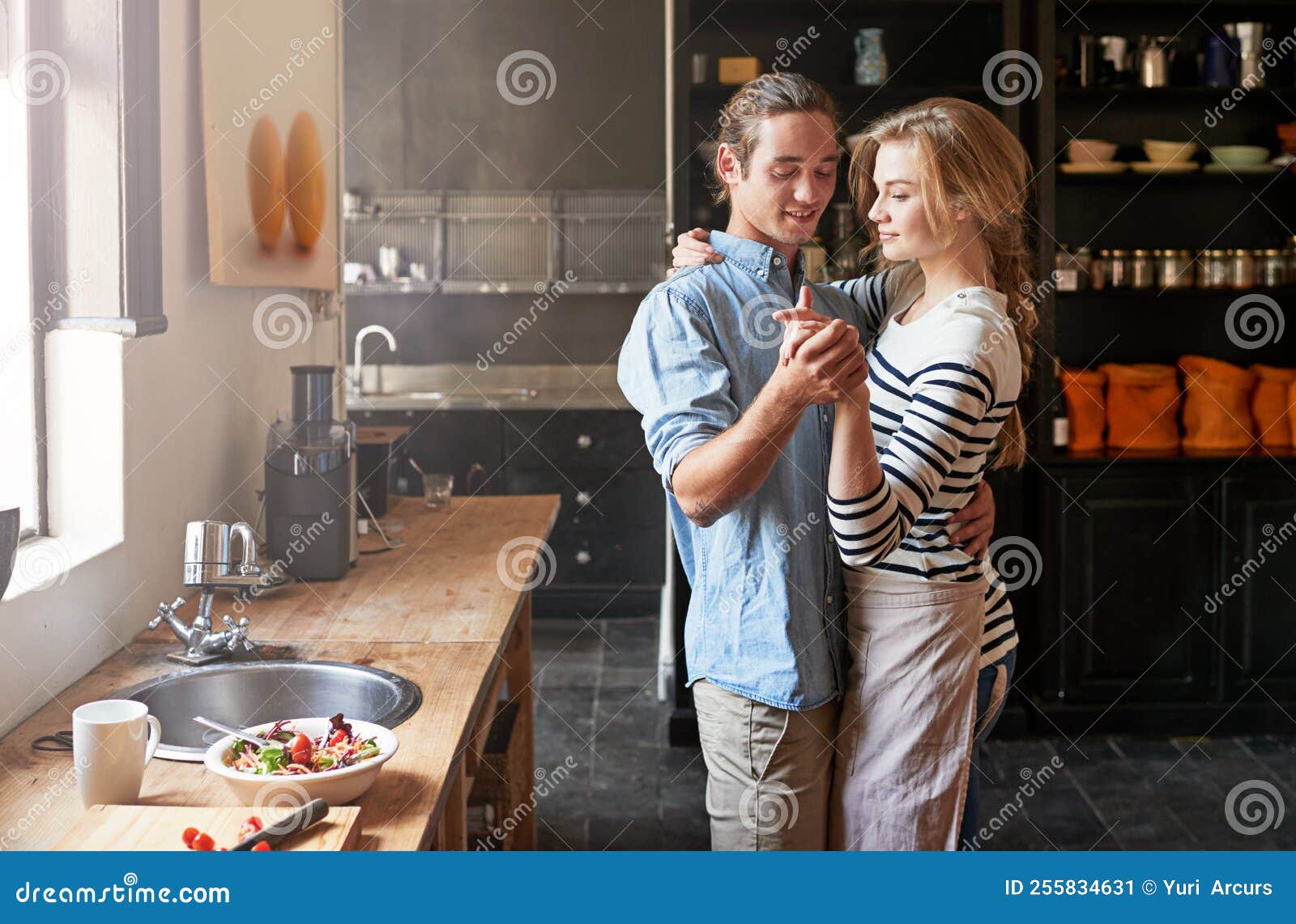 The Kitchen is for Dancing. a Young Couple Dancing in the Kitchen