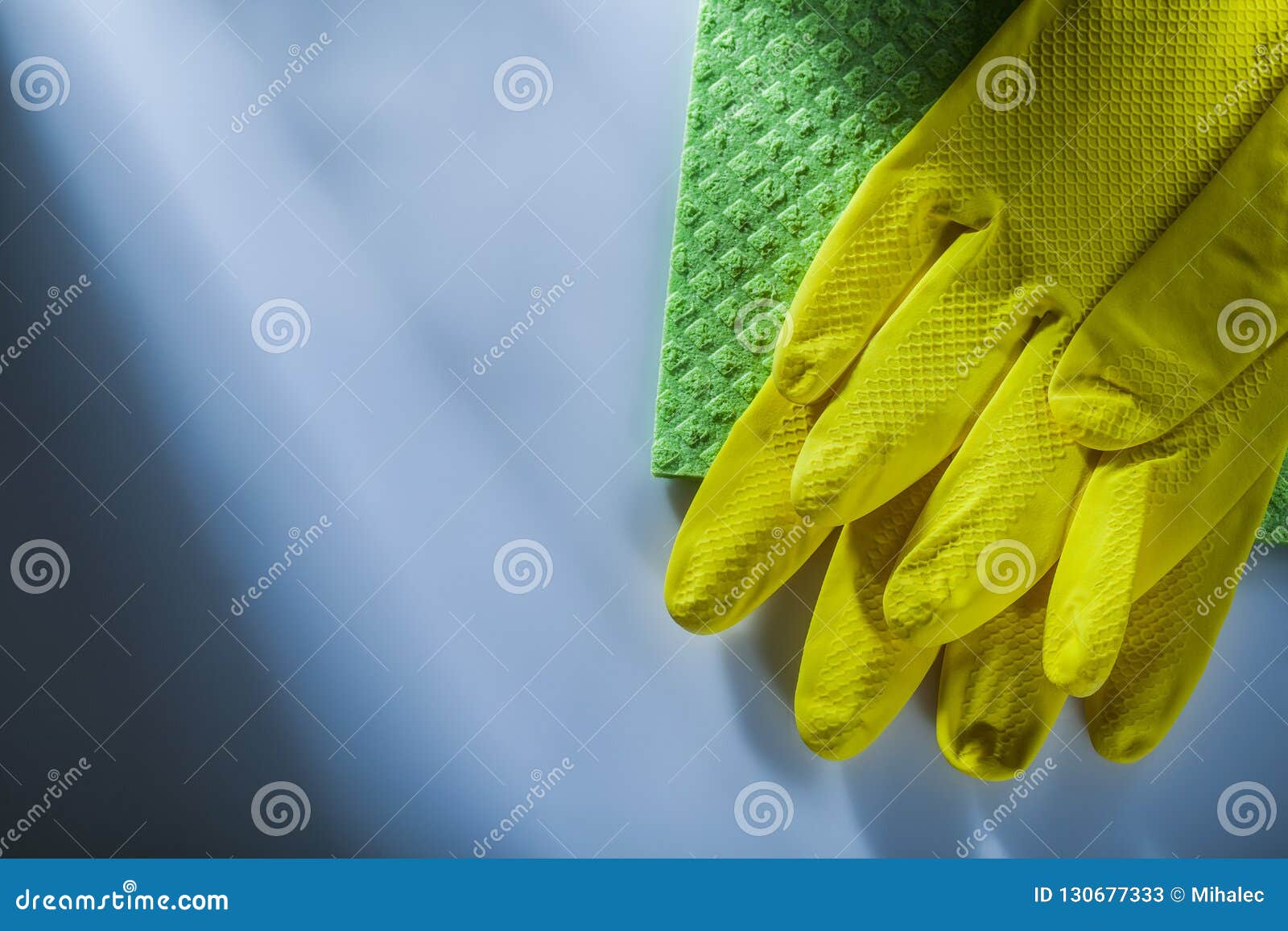 Kitchen Dishwashing Cloth Protective Gloves on White Surface Stock