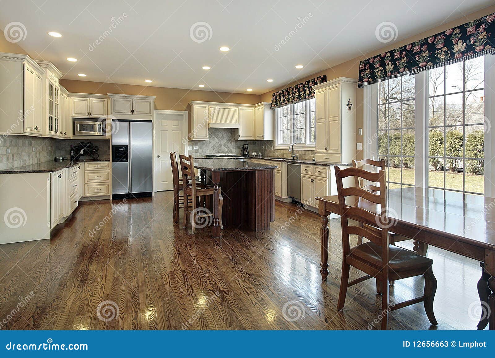 Kitchen with eating area stock image. Image of lighting 12656663