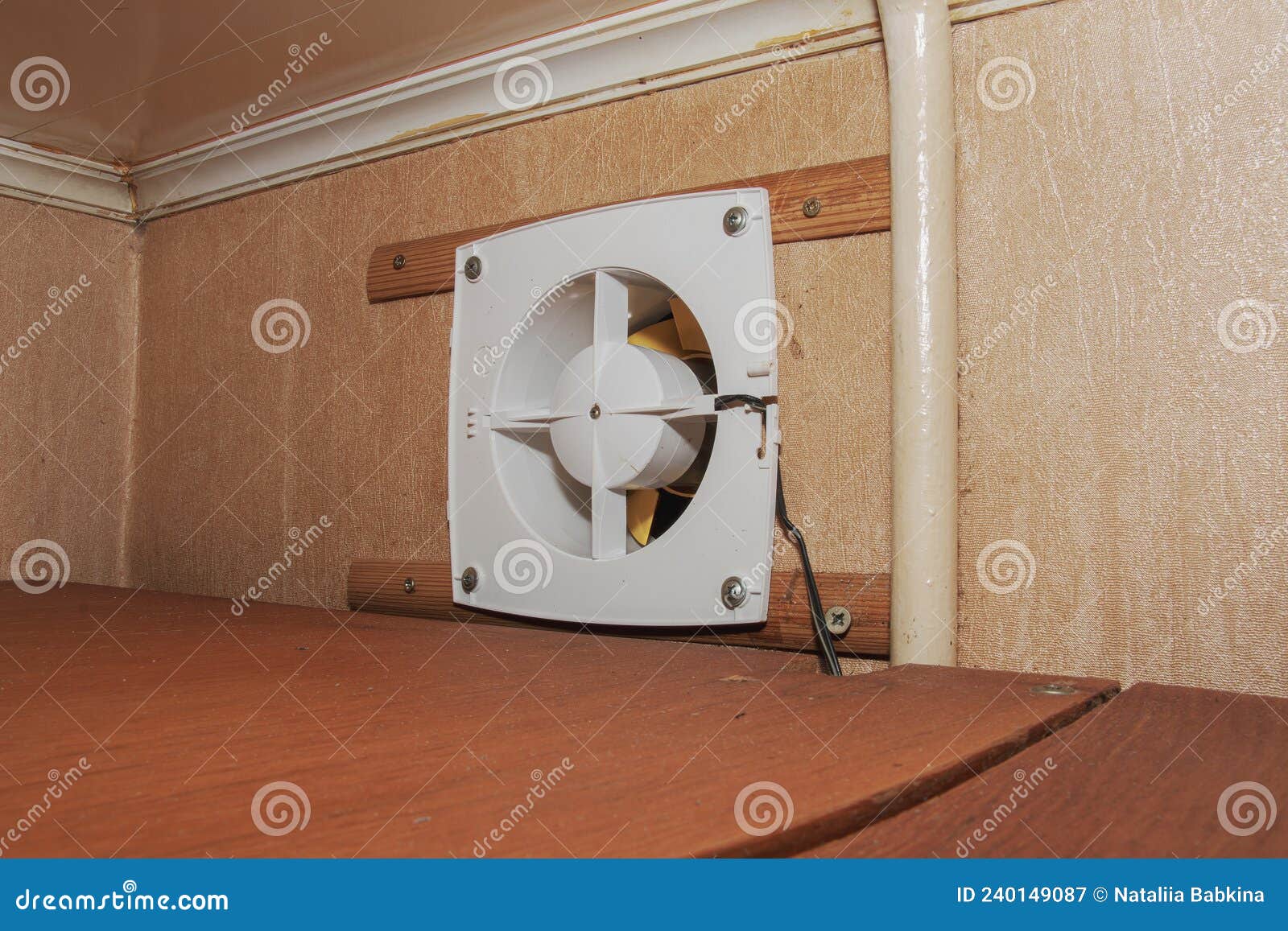 The Kitchen Exhaust Fan after Cleaning and Washing is Installed on the