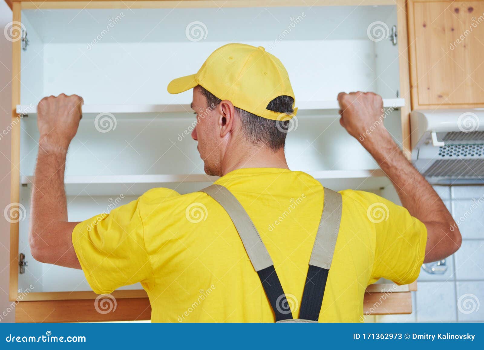 Kitchen Installation. Worker Assembling Furniture Stock Image Image