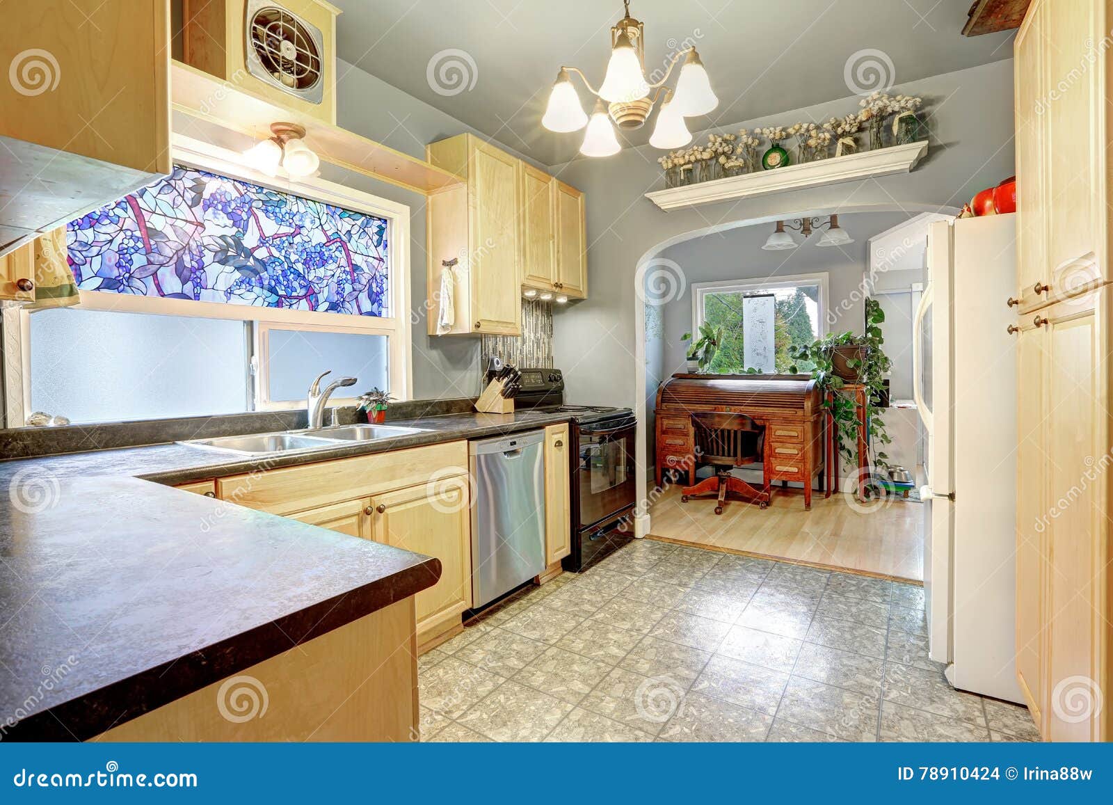 Kitchen Interior With Golden Cabinets Black And White Appliances