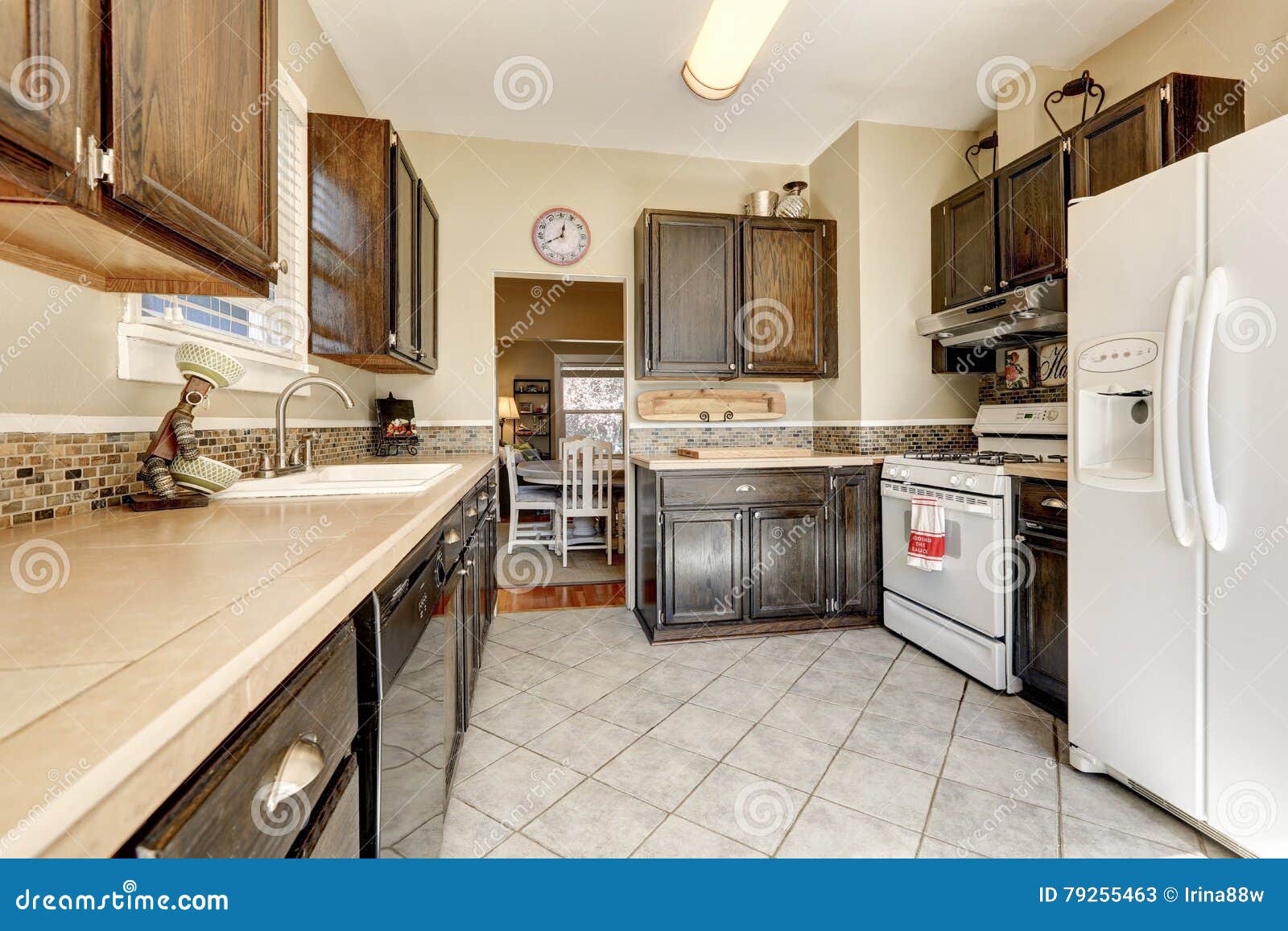 Kitchen Room Dark Brown Cabinets And White Appliances Stock