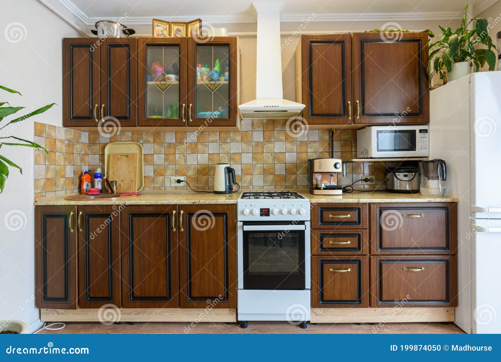 Kitchen Set for Dark Wood in a Standard Apartment Stock Photo Image
