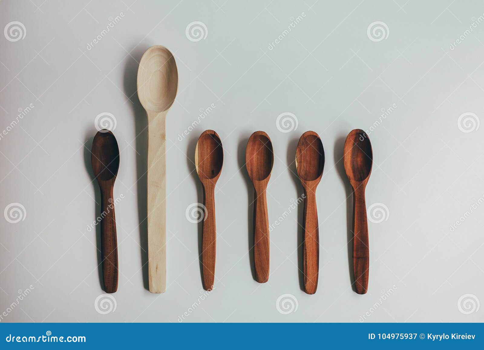 kitchen utencils set for takeaway business: wooden recycling eco spoon, fork  on white side view. eco style, wood, wooden