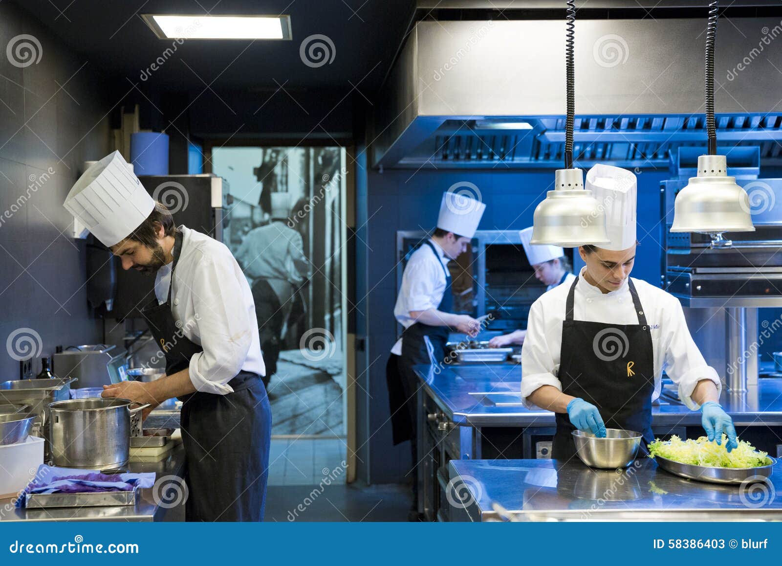 Kitchen workers editorial stock photo. Image of preparing 58386403