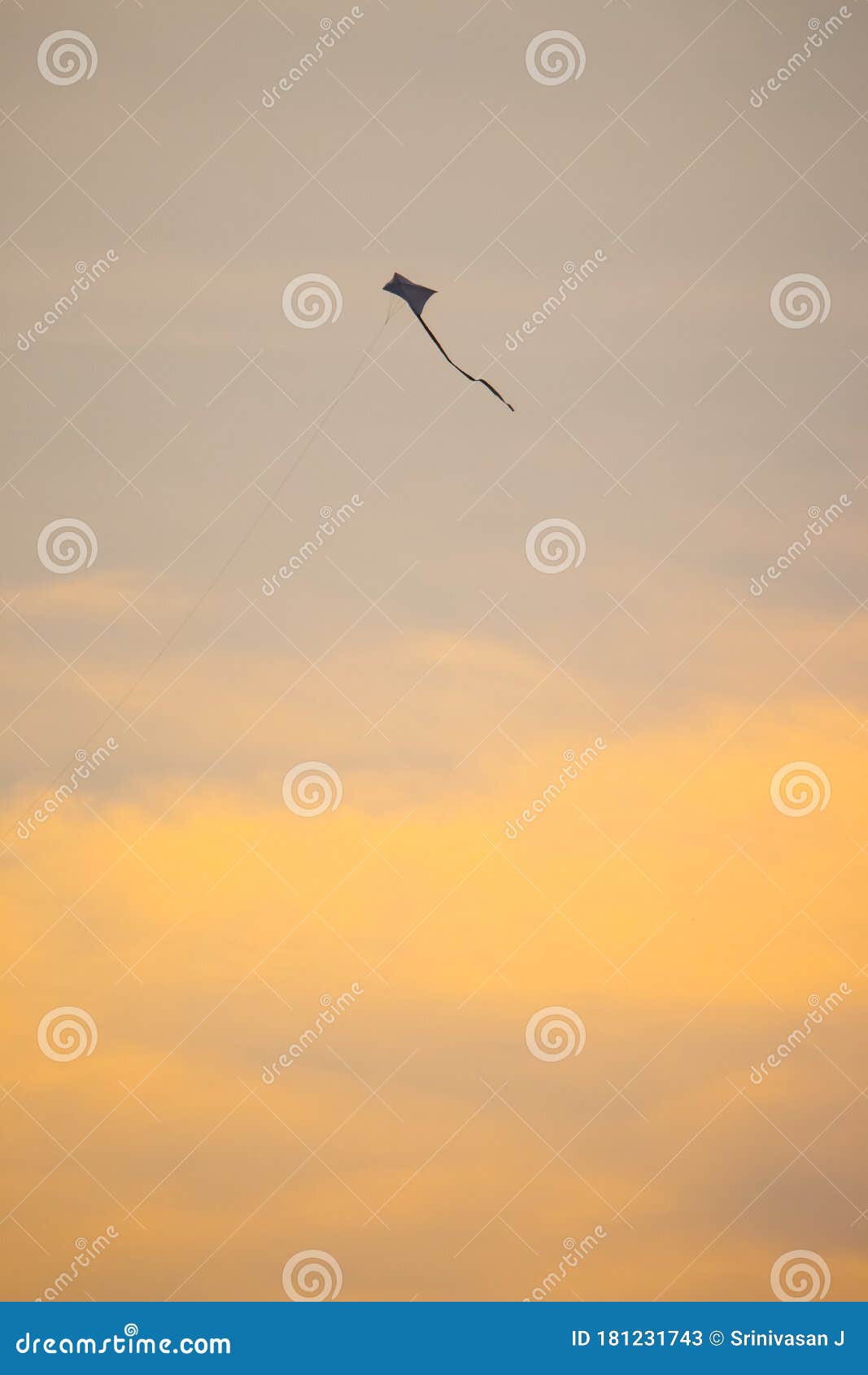 Kite Fly in the Wind. Kite Flying Against Sky Isolated on Yellow