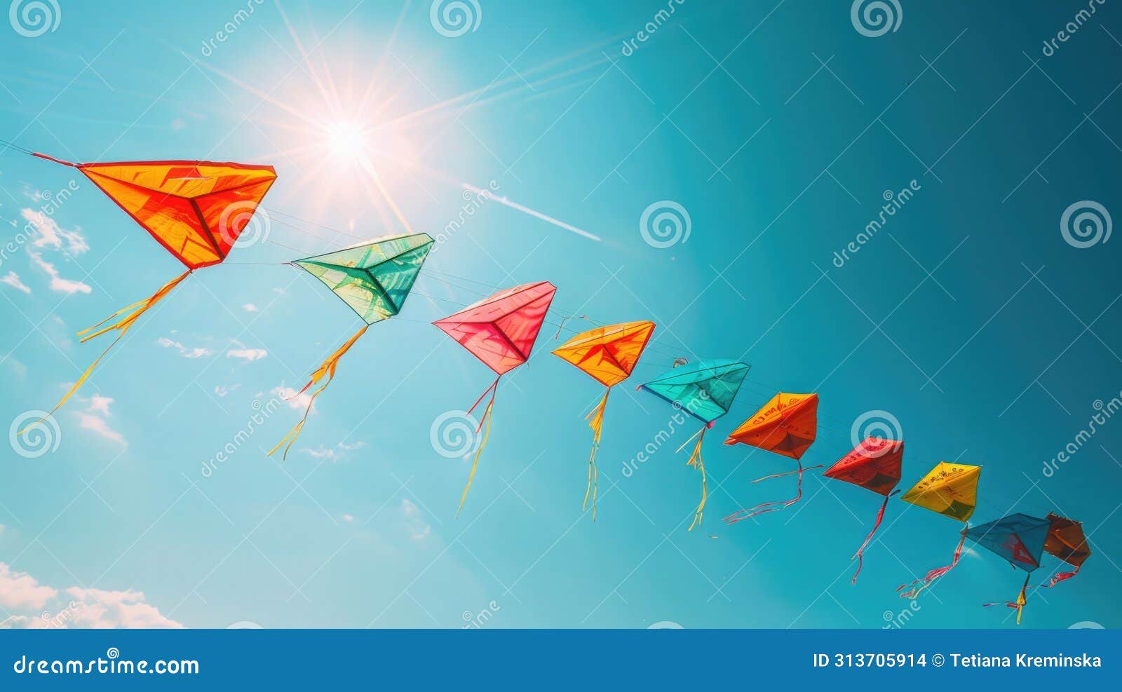 a kite flying against a clear blue sky, is a popular sinhalese new year activity. the kites are brightly colored