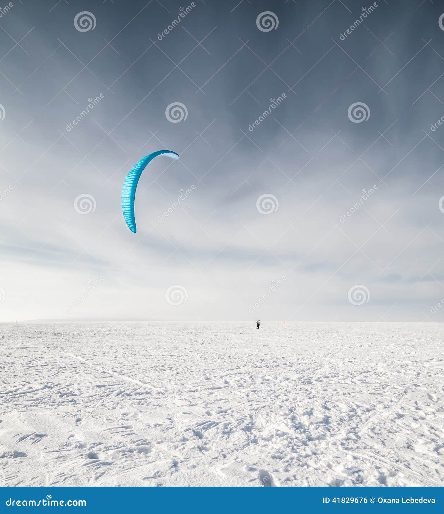 Kiteboarder with Blue Kite on the Snow Stock Photo Image of dusk