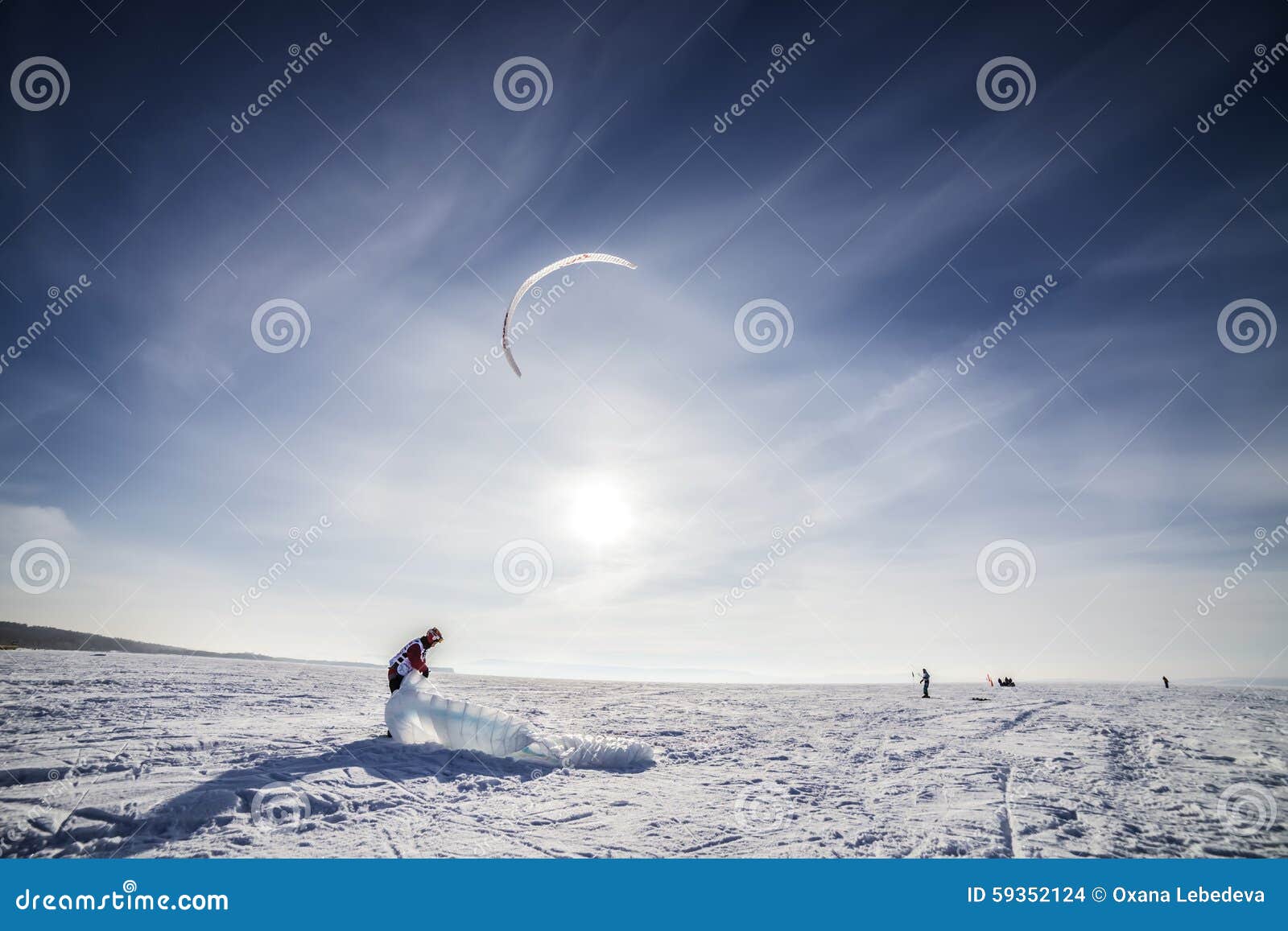 Kiteboarder with Blue Kite on the Snow Stock Photo Image of power