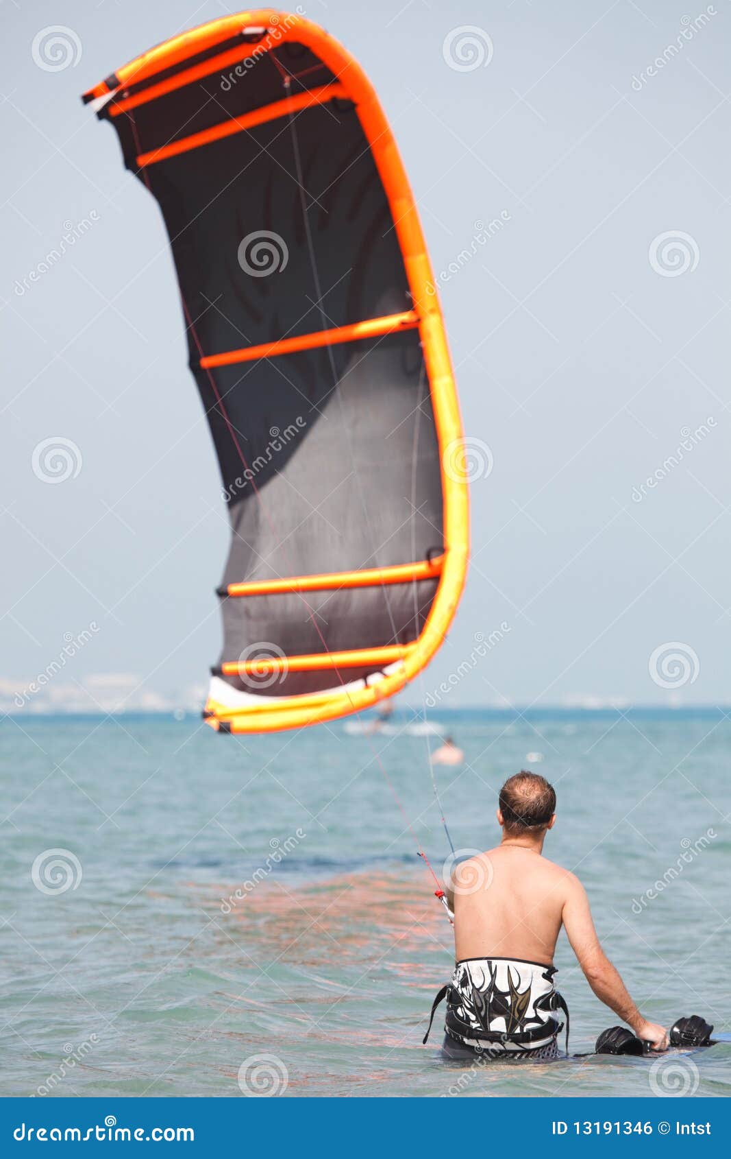 Kiteboarder lifting kite stock photo. Image of board 13191346