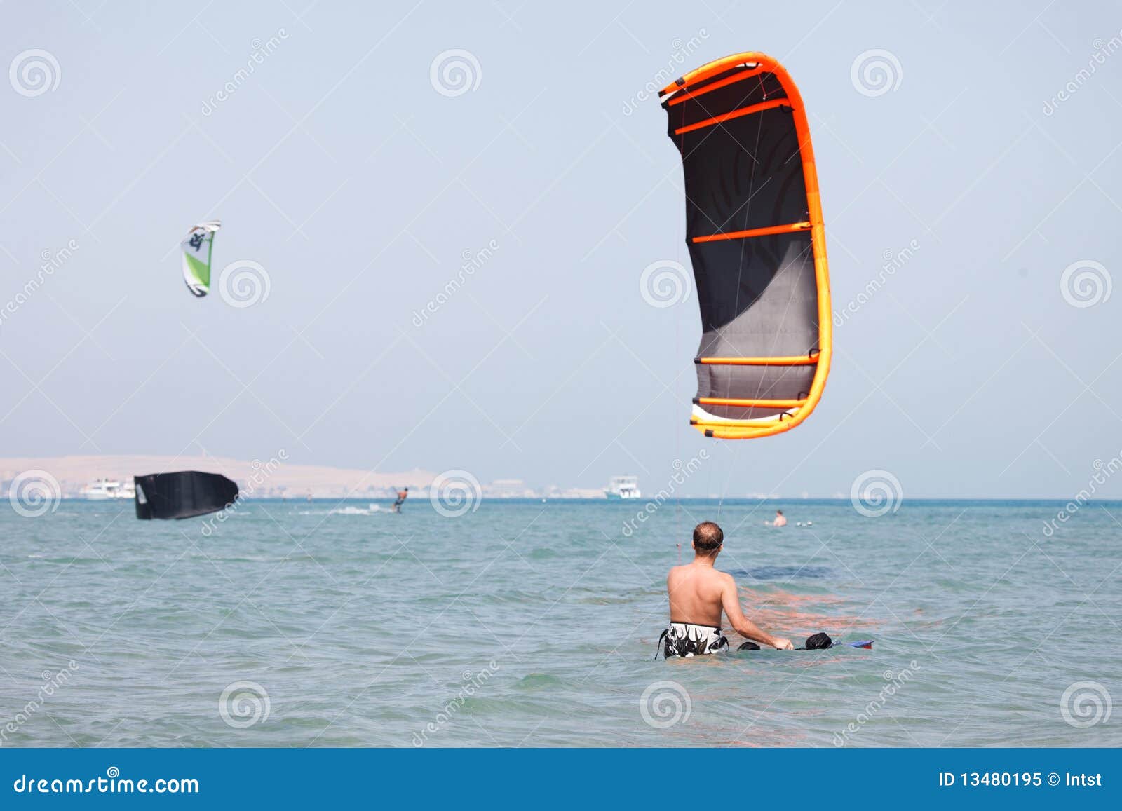 Kiteboarder lifting kite stock image. Image of blue, caucasian 13480195