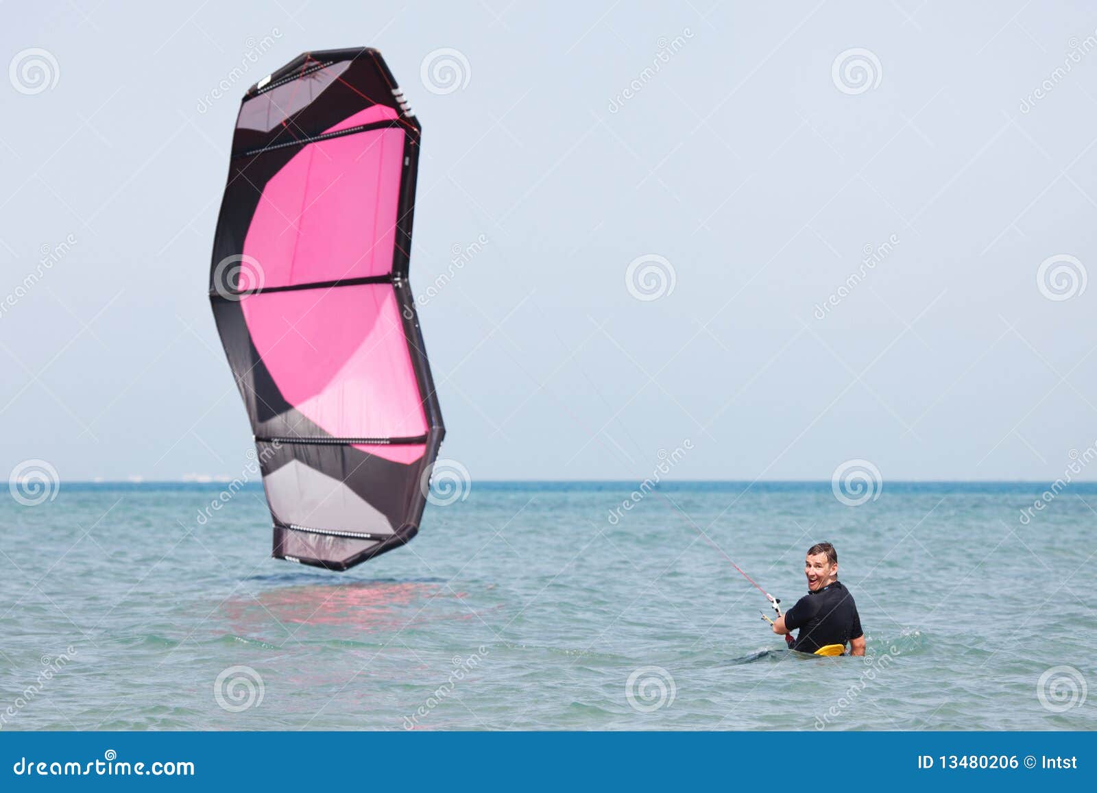 Kiteboarder lifting kite stock photo. Image of board 13480206