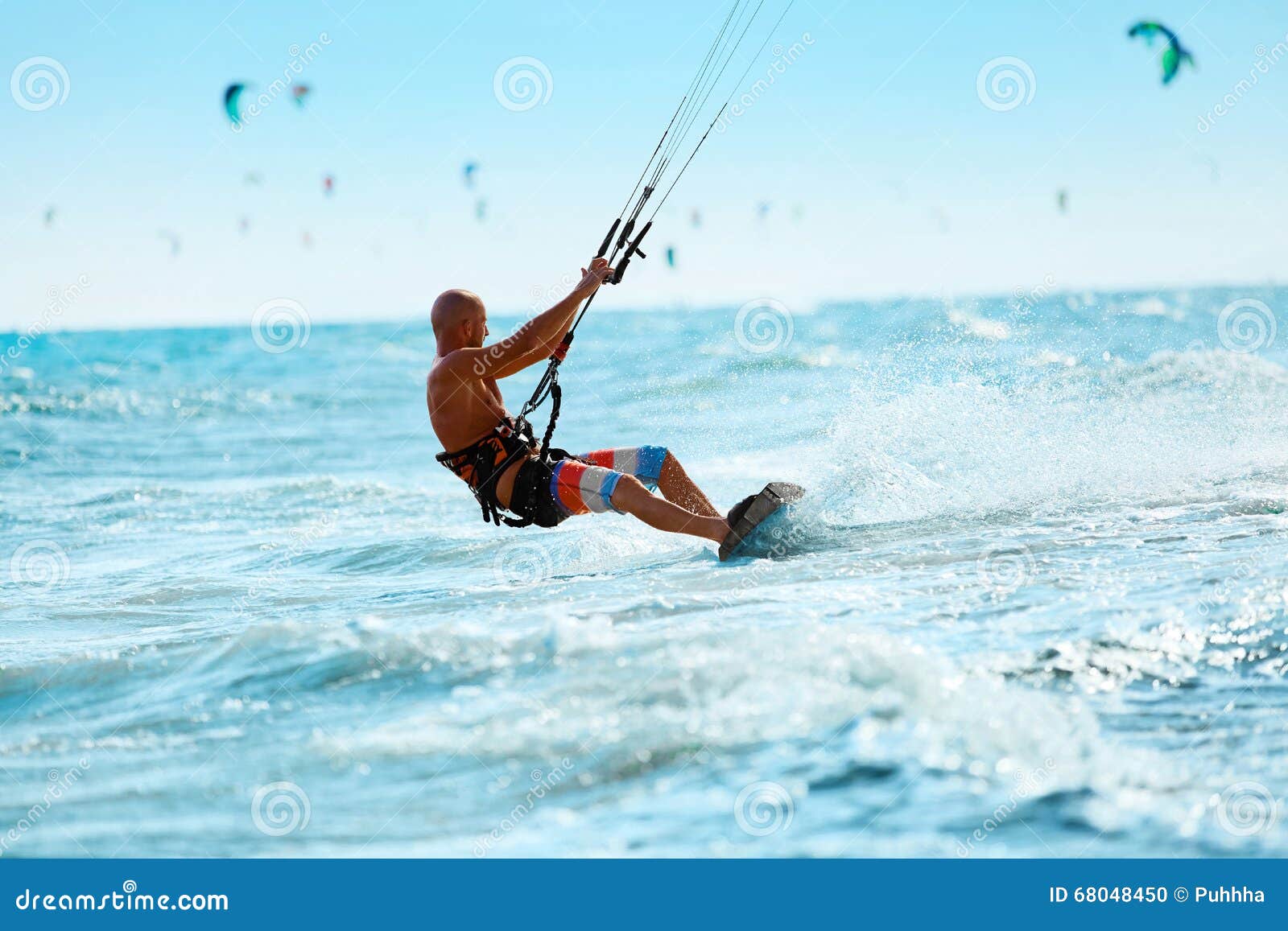 kiteboarding, kitesurfing. water sports. kitesurf action on wave