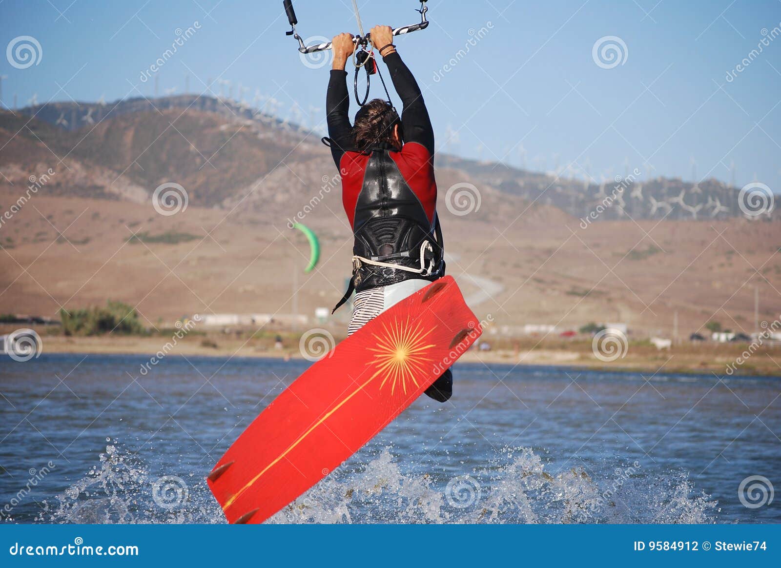 kiter flying on the waves near tarifa, spain