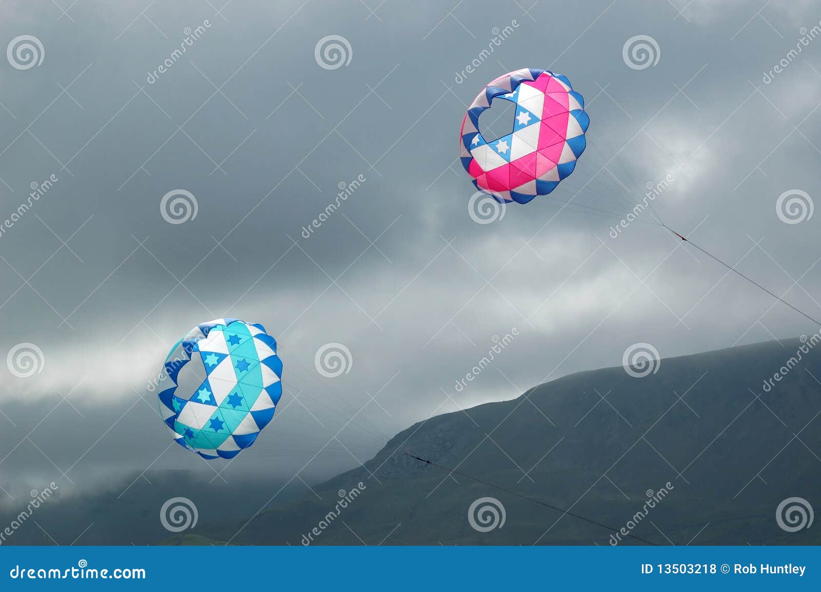 Kites flying in stormy sky stock photo. Image of clouds 13503218