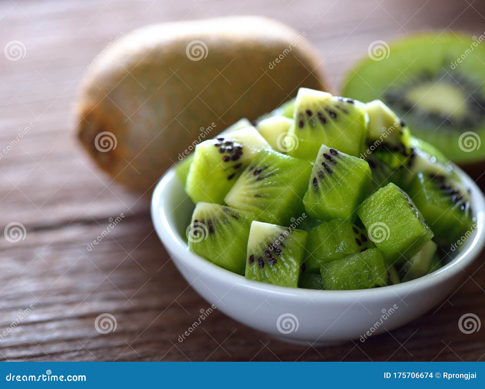 Kiwi fruit in white bowl stock photo. Image of organic 175706674