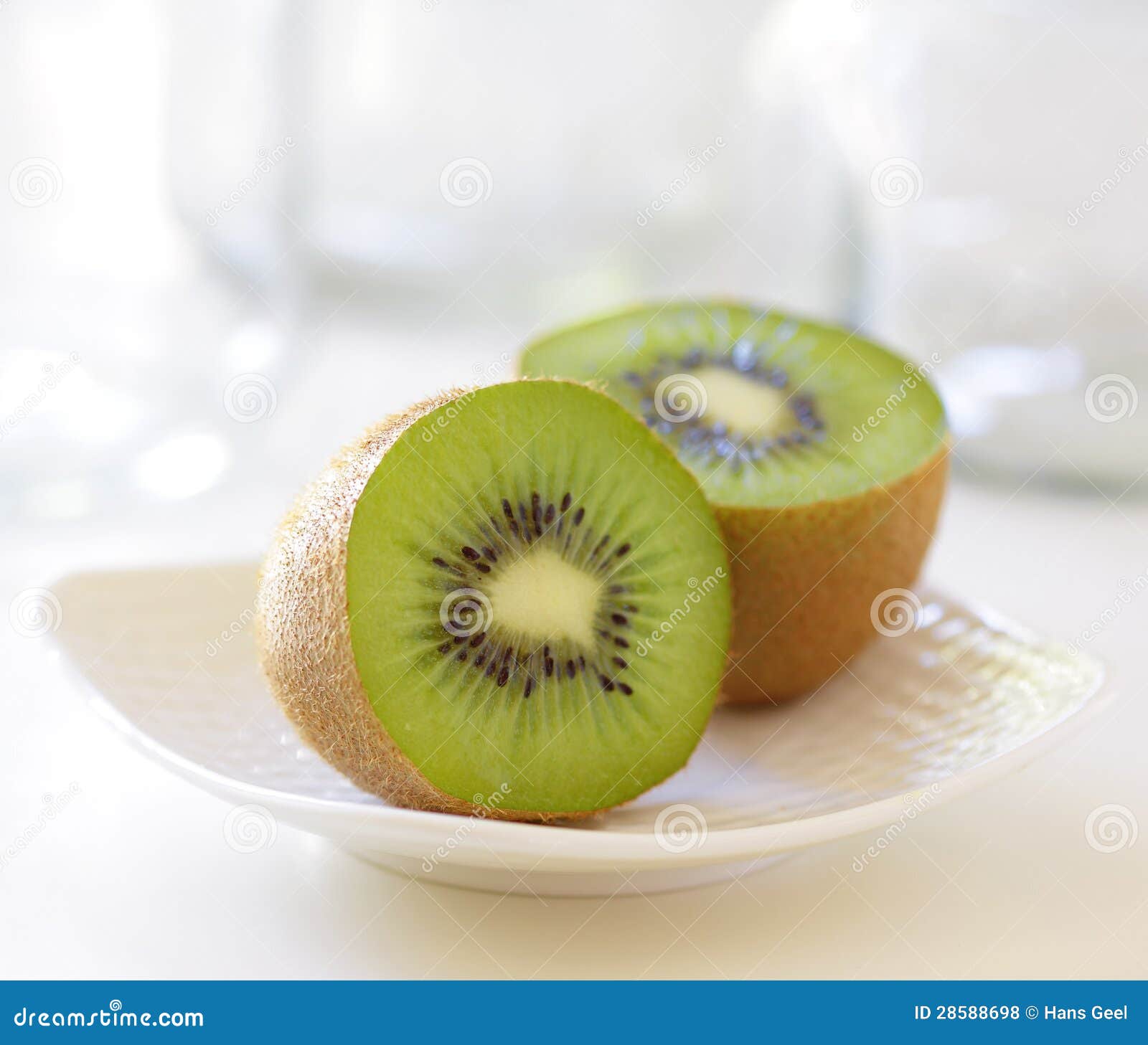 Kiwi halves on a dish stock photo. Image of ripe, plate - 28588698