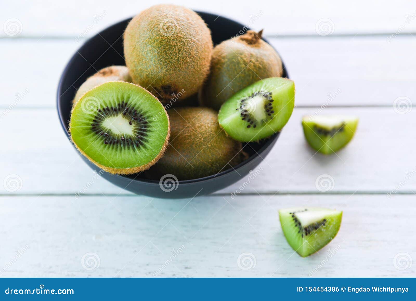 Kiwi Slice in Bowl / Fresh Kiwi Fruit on the Table Wooden Stock Photo