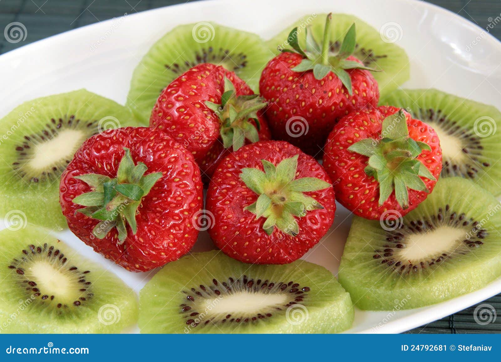 Kiwi And Strawberries On A White Dish Stock Image - Image of portion