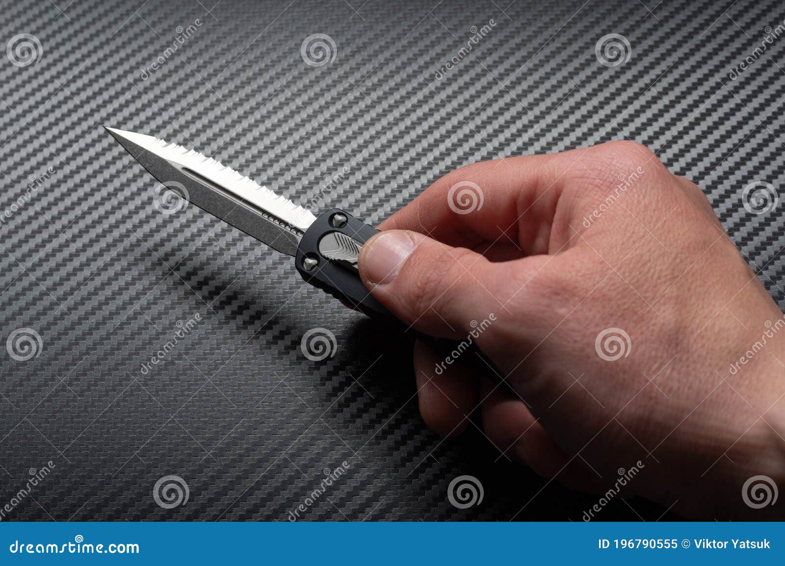 A Knife with a Doublesided Sharpened Blade. Automatic Folding Knife