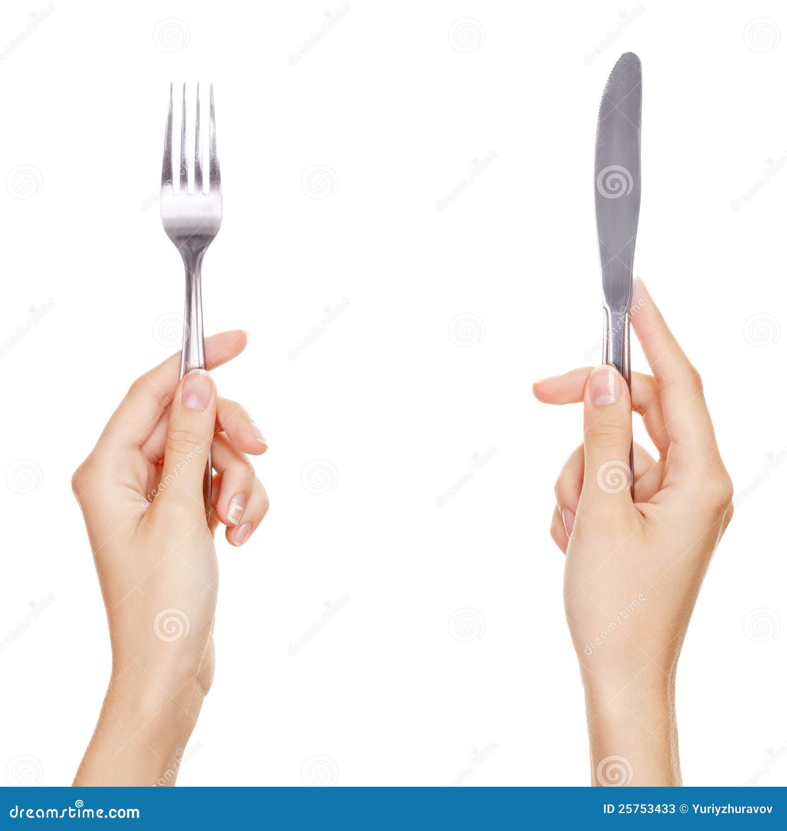 a knife and fork being held by womans hands.