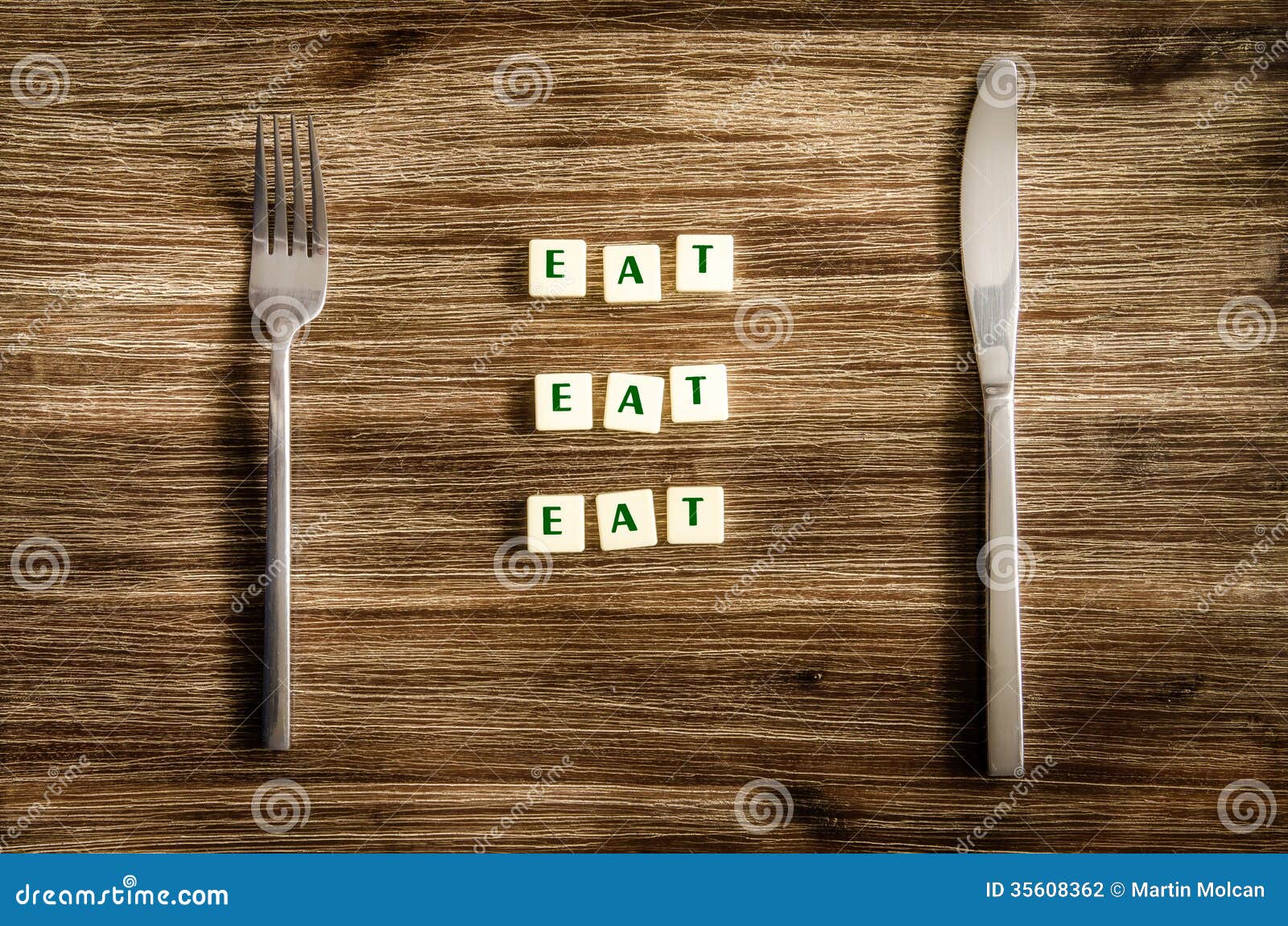 Knife and Fork Set on Wooden Table, Sign Saying Eat Stock Photo Image of dining, flatware