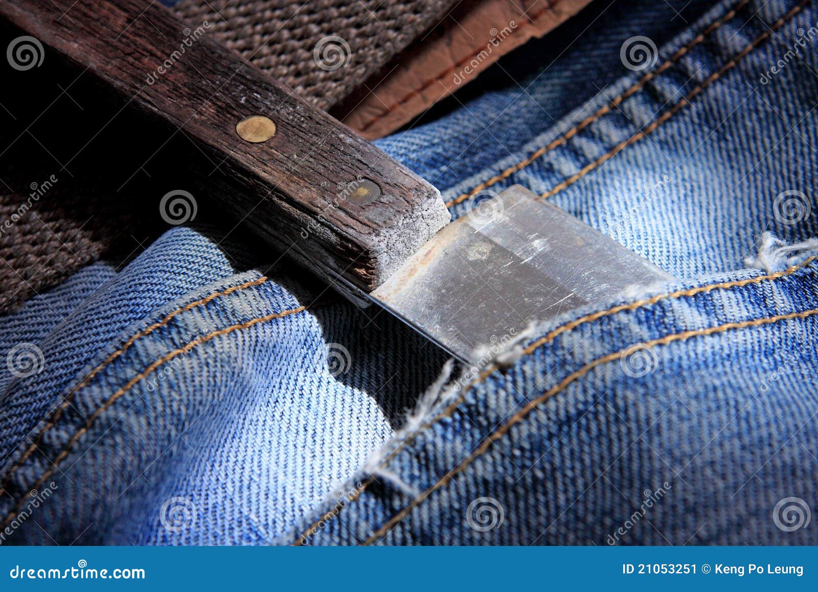 Knife in jeans pocket stock image. Image of studio, kill 21053251