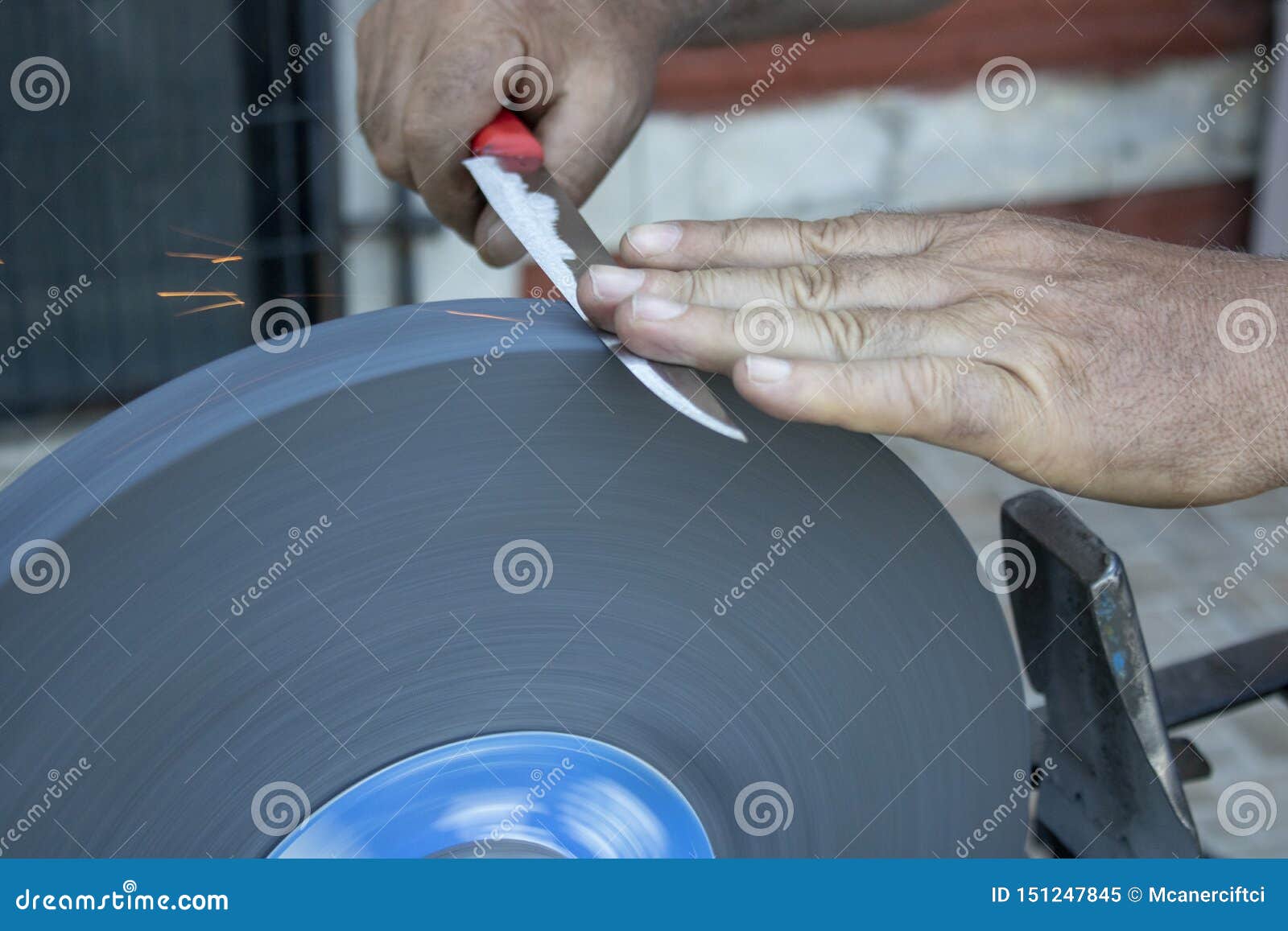 Knife Sharpening Hand and Sanding Machine Closeup Stock Image Image