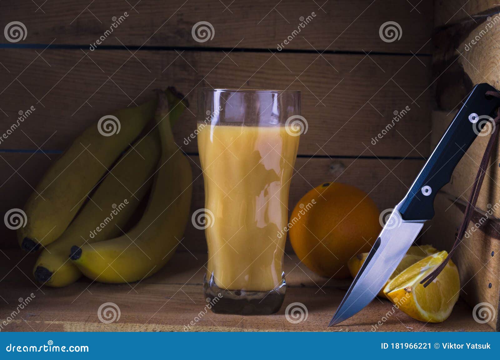 a knife with a shiny sharp blade. fruit juice and fruits. low key