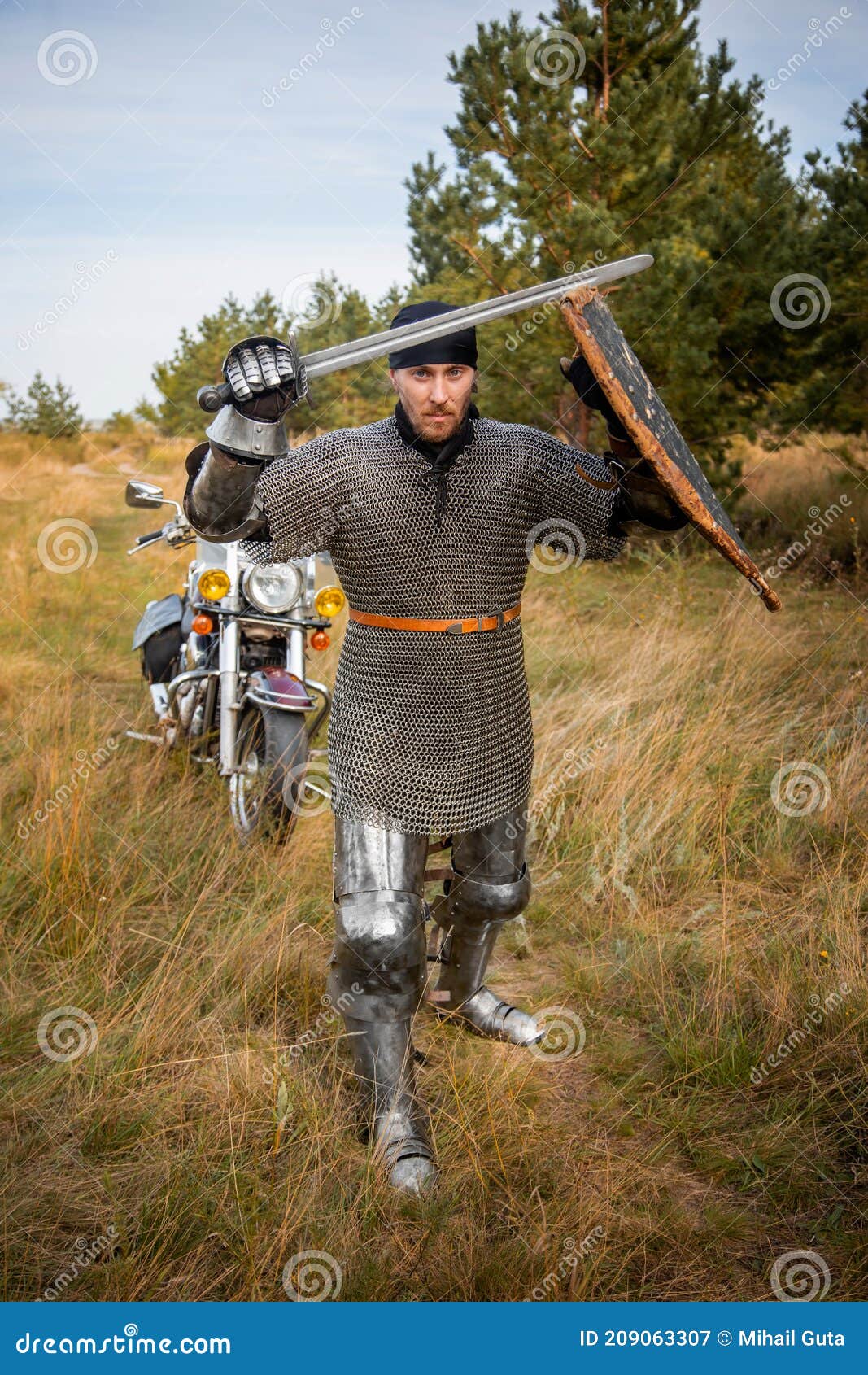 https://thumbs.dreamstime.com/z/knight-chainmail-shield-sword-his-hands-stands-against-backdrop-motorcycle-forest-medieval-209063307.jpg