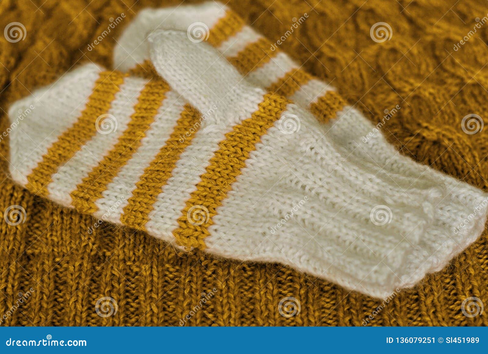 Knit Homemade Knitted Striped Mittens On Knitted Pattern
