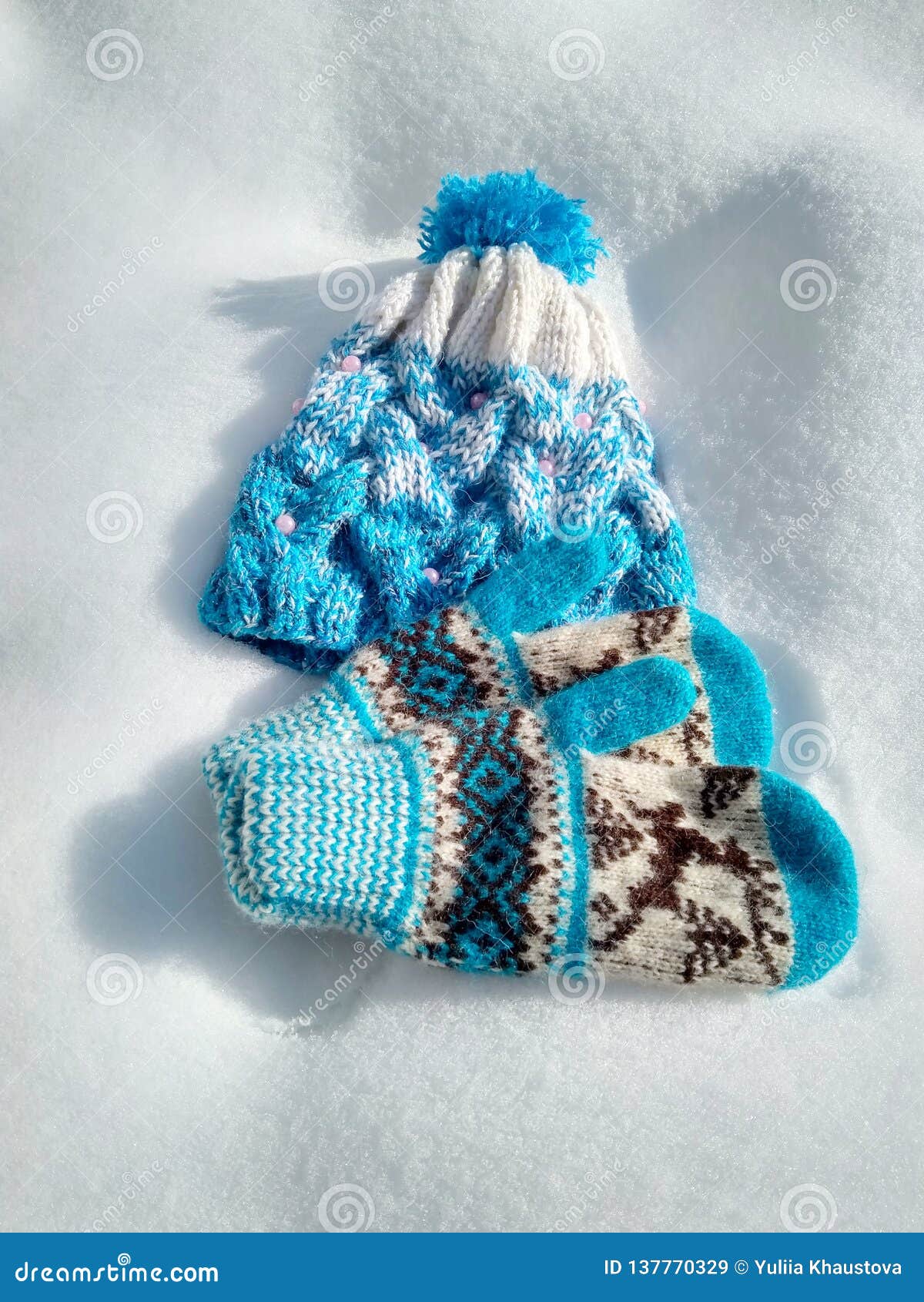 Winter Clothes, Knitted Hat and Mittens in the Snow Stock Image - Image ...