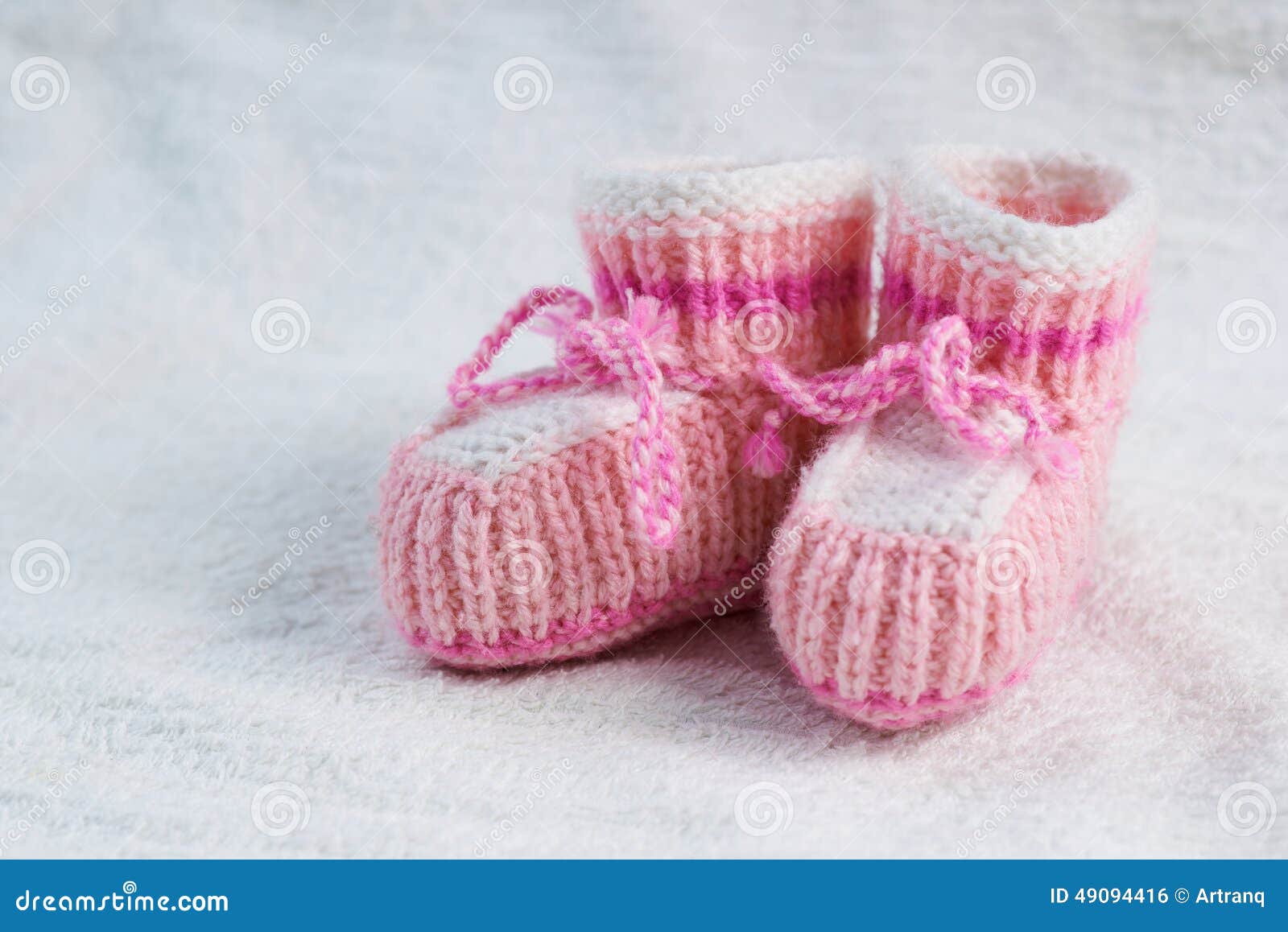 Knitted pink baby boots stock photo. Image of footwear 49094416