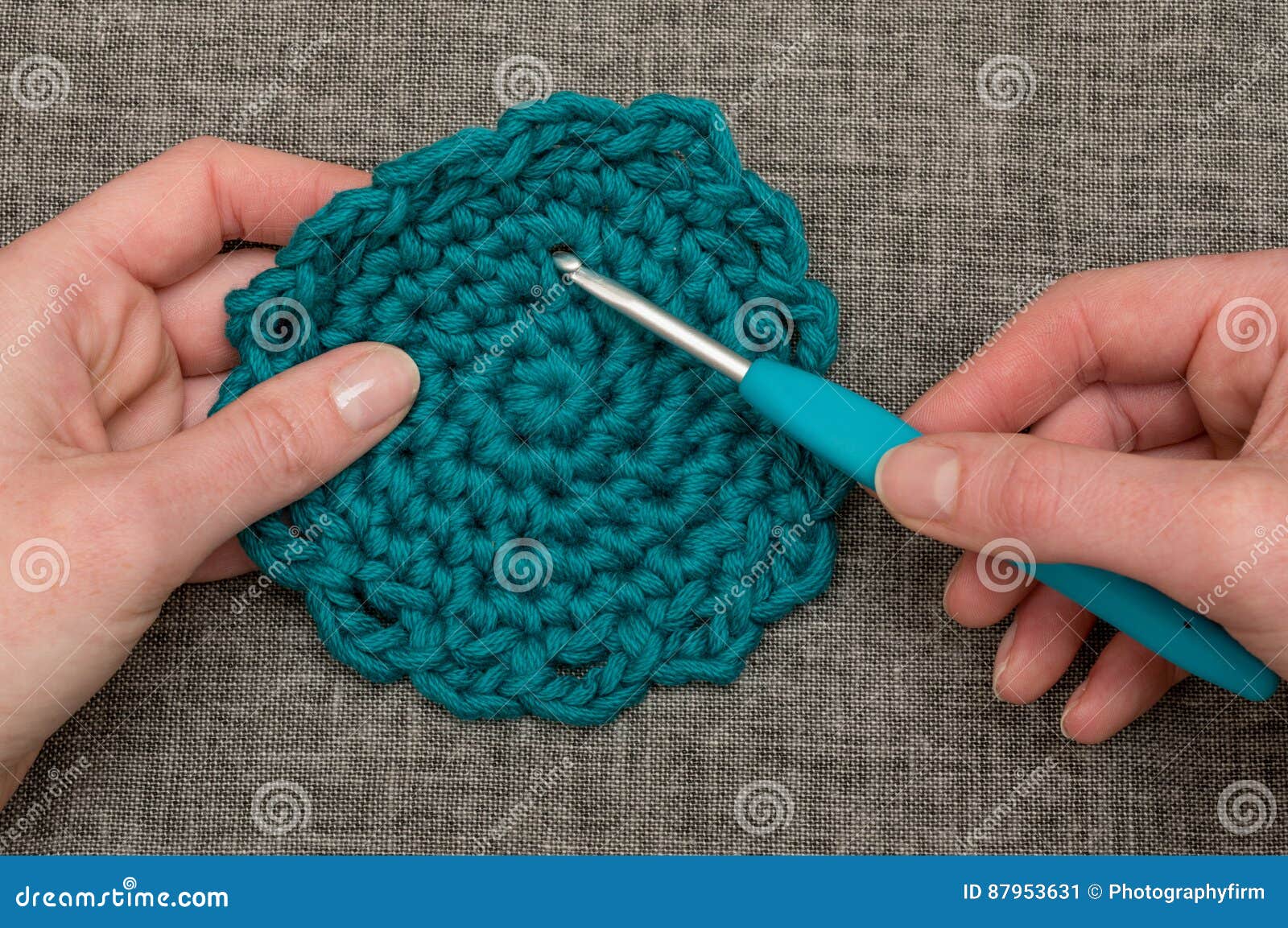 Knitting Hook Piercing a Round Teal Crocheted Coaster Stock Image - Image  of close, knitting: 87953631