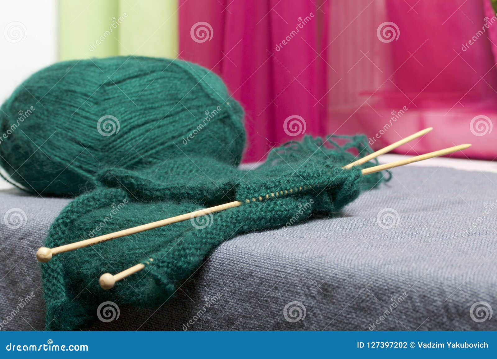 Knitting with Wooden Knitting. a Ball of Dark Green Thread and Wooden ...