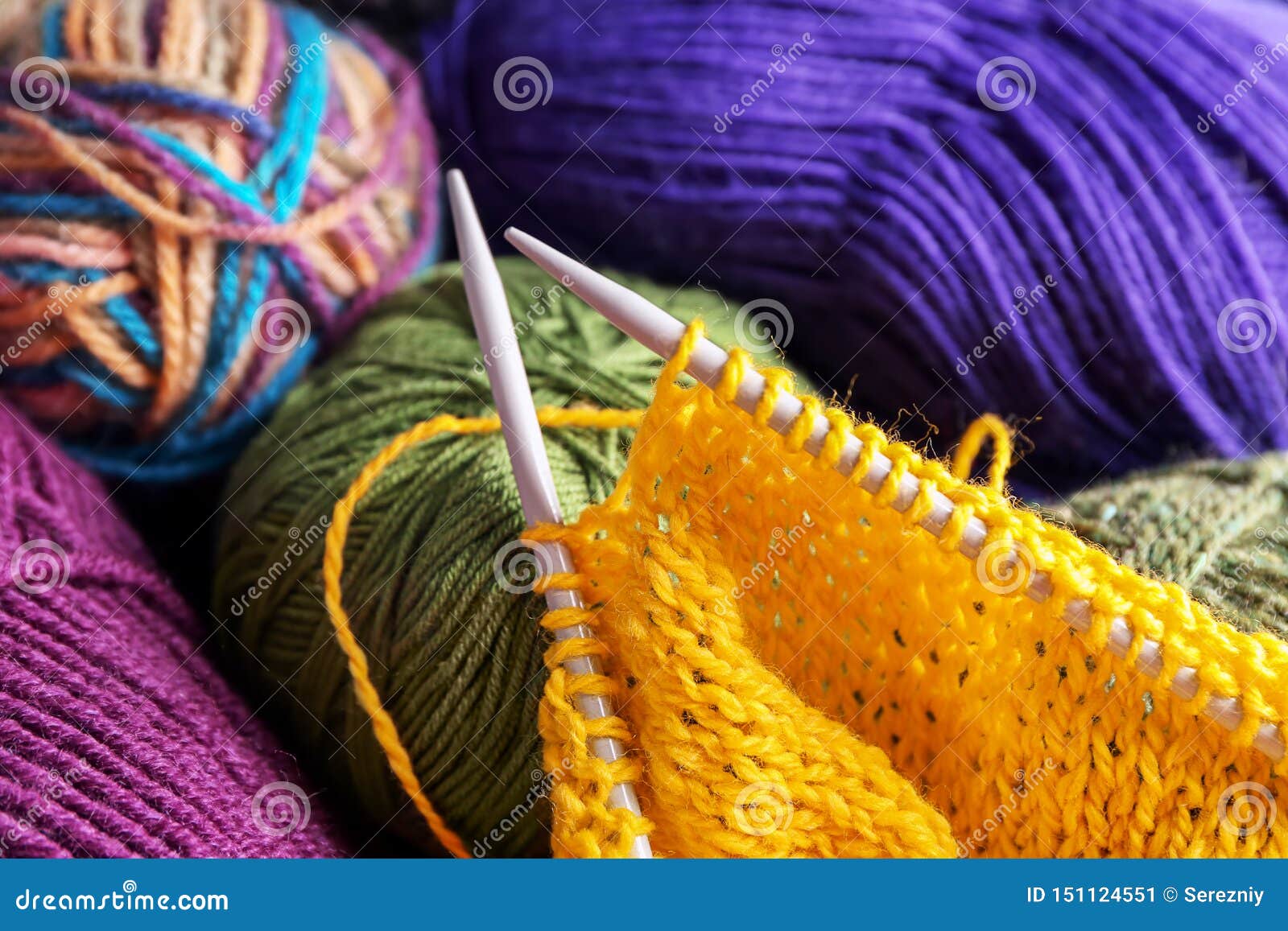 Knitting Yarn, Needles and Unfinished Clothes, Closeup Stock Image ...