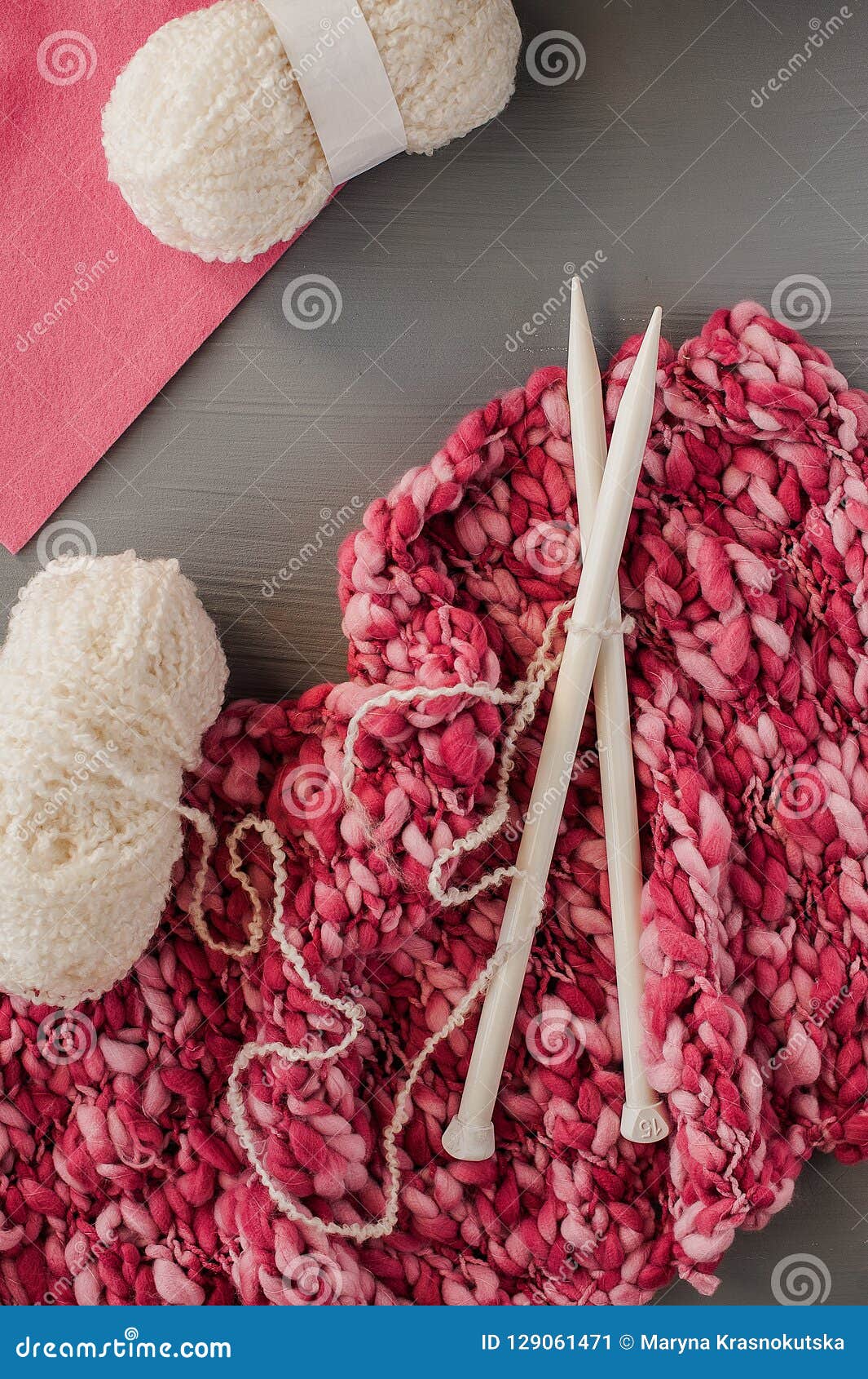 Knitting Yarns and Knitting Needles on Grey Background. Stock Image