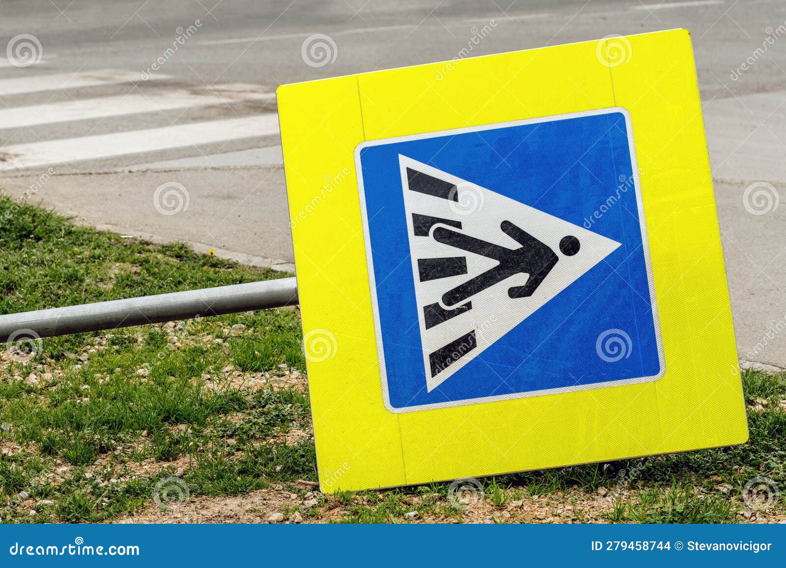 knocked down european pedestrian crossing sign