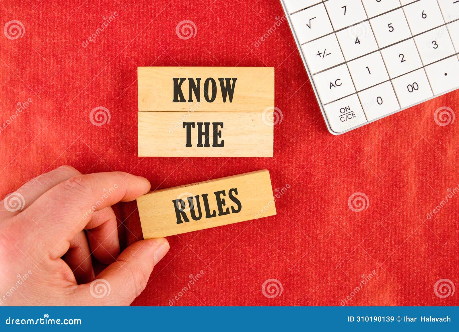 know the rules text. wooden blocks. beautiful red background.