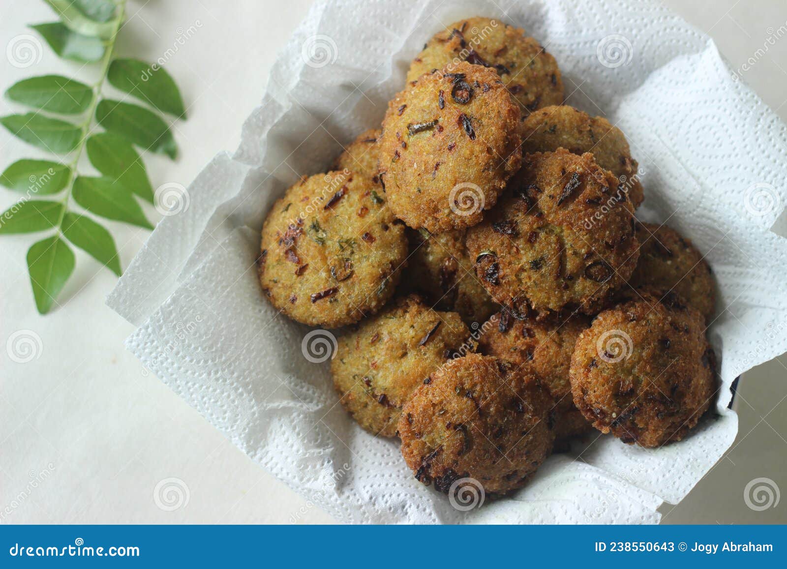 kodo millet fritters. a crispy fritters made with cooked and mashed kodo millet flour and spices. disk d deep fried evening