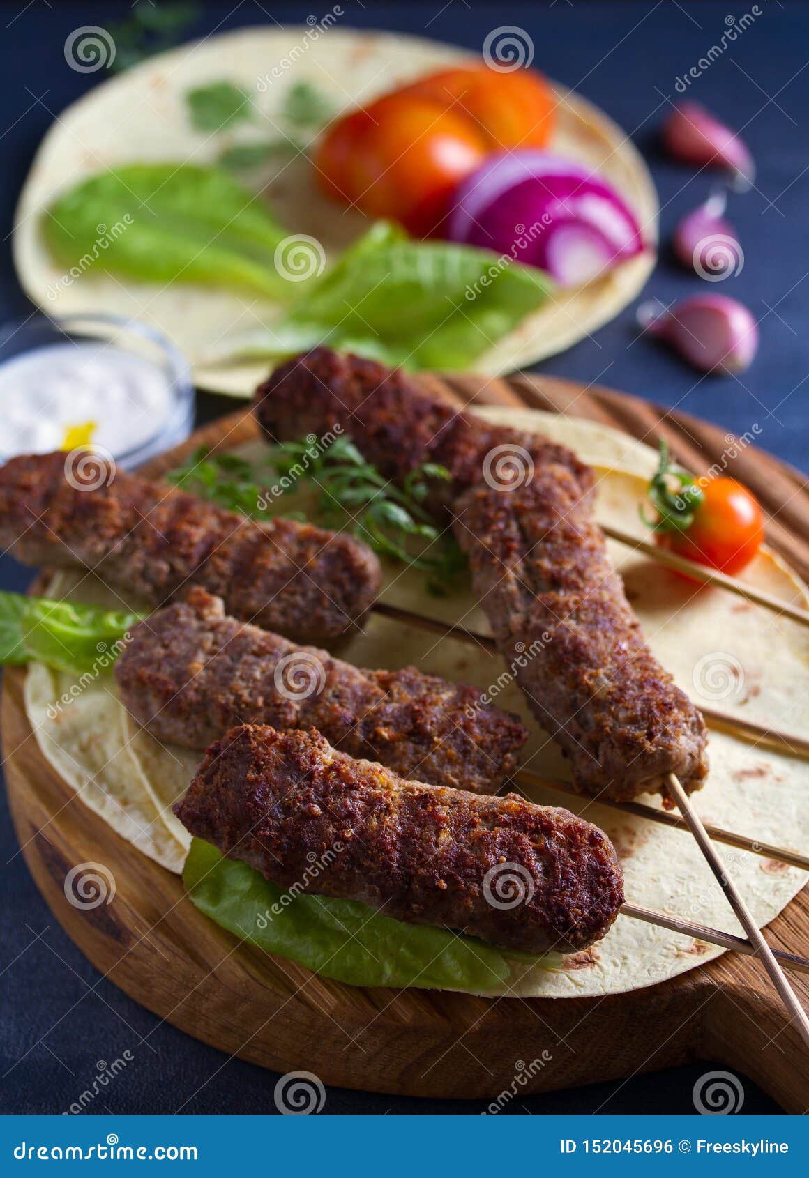 Kofta Kebabs with Pita Bread, Vegetables and Yogurt Sauce. Stock Photo