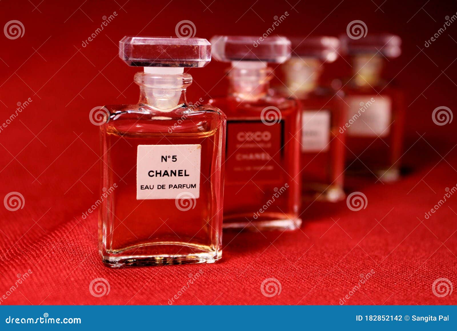 Chanel Perfume Bottles Isolated on Red Background. Bottles with ...