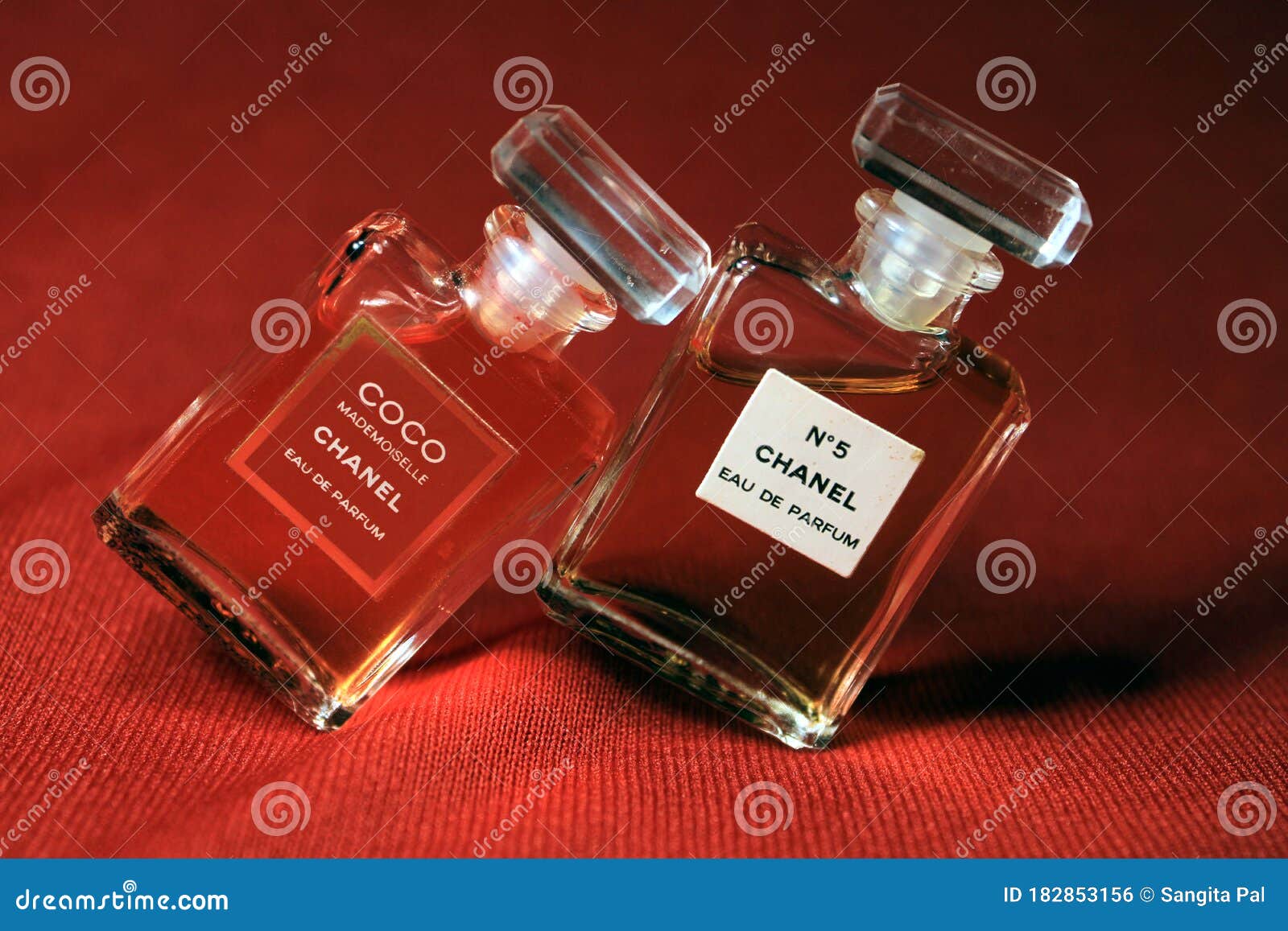 Chanel Perfume Bottles Isolated on Red Background. Bottles with ...